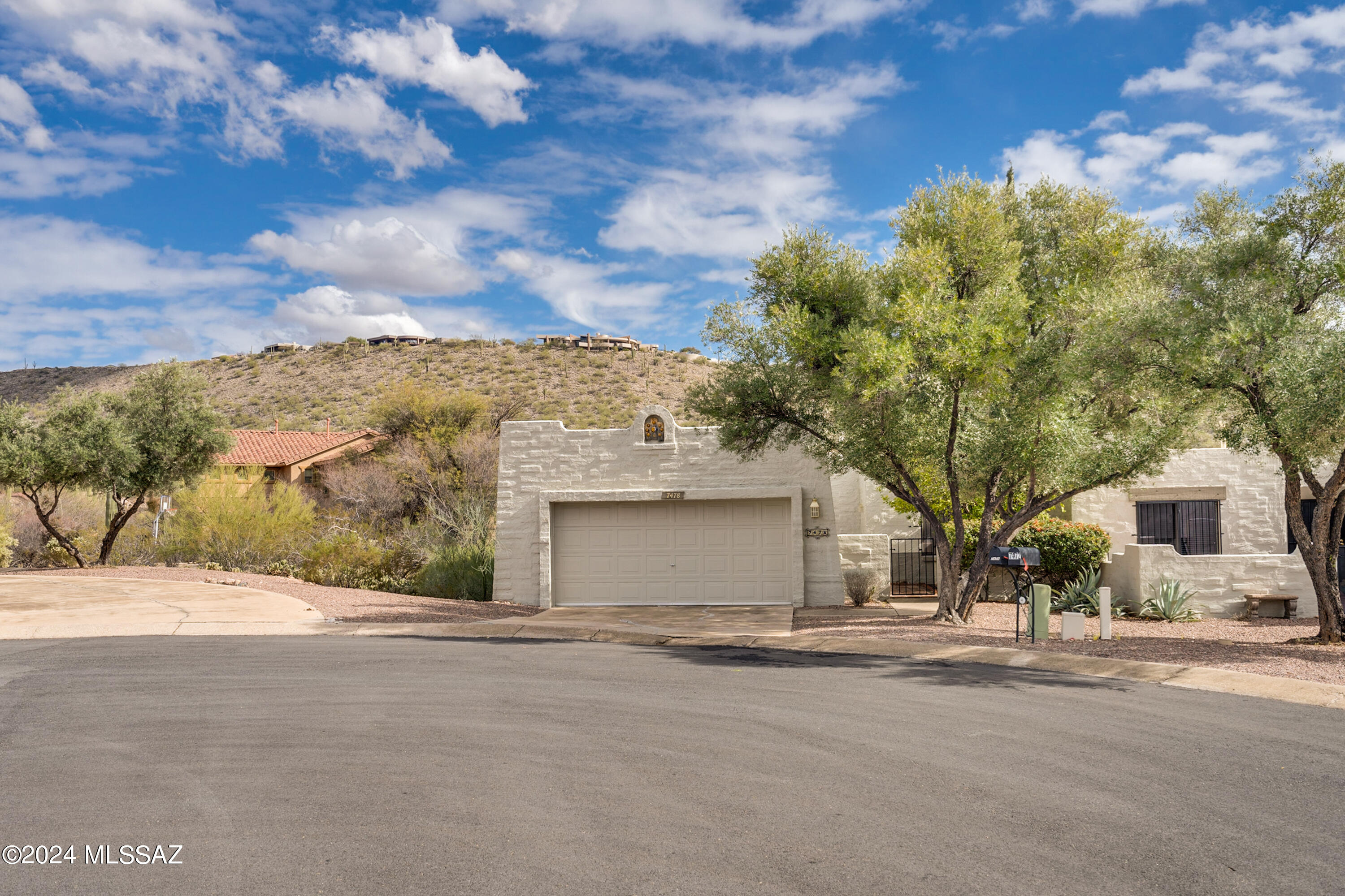 Come fall in love with this 3 bedroom 2 bath Quail Canyon townhome nestled in the foothills between Ventana & Sabino Canyons. Enter through a private gated front courtyard and enjoy Catalina views and privacy.   This spacious home features newer tile, natural lighting with skylights, great room with fireplace and separate dining area. The galley style kitchen also has a breakfast nook to enjoy morning coffee and admire the mountain views! Large primary suite with dual vanity and newer walk-in shower. Ceiling fans throughout. The back yard features brick paved covered patio with mountain views galore.  Enjoy the serenity and sunsets while listening to the sounds of the desert.  BONUS...Be sure to visit the community pool & spa which is within walking distance!