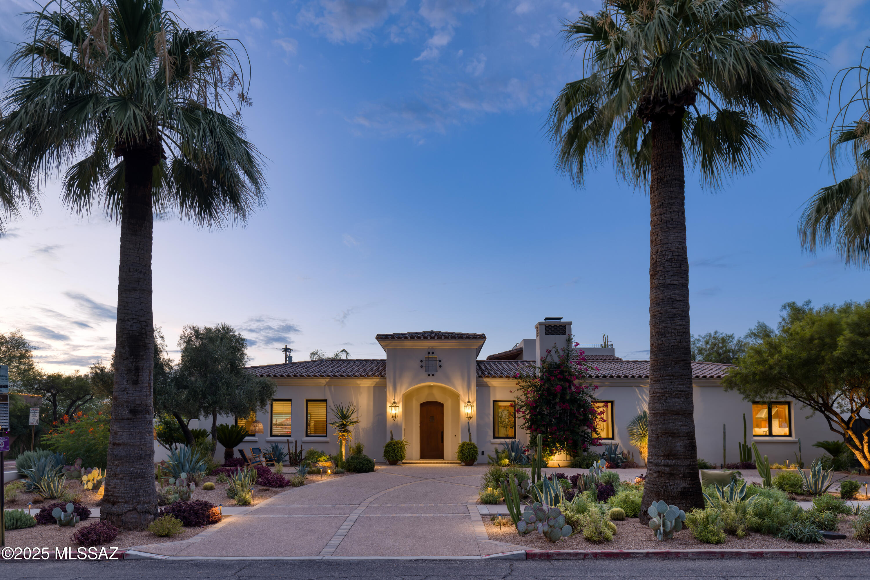 In the heart of Sam Hughes, this rare 2015 Seaver Franks-designed masonry home (remodeled 2021) blends historic charm with modern scale. The main residence offers a phenomenal great room, 4 bedrooms, 4 baths, a large wood paneled office, and an oversized 3-car garage. A private guest house includes a bedroom, bath, living room, and kitchenette. Resort-style backyard with pool, mature citrus, and expansive roof deck with panoramic city and mountain views. Interiors feature curated finishes, in-floor radiant heating, soaring ceilings and seamless flow. Additional highlights: all new HVAC (2025), hardwired ethernet, and whole-home audio. An extraordinary opportunity in Tucson's most coveted historic neighborhood. Owner is a licensed agent in the state of Arizona.