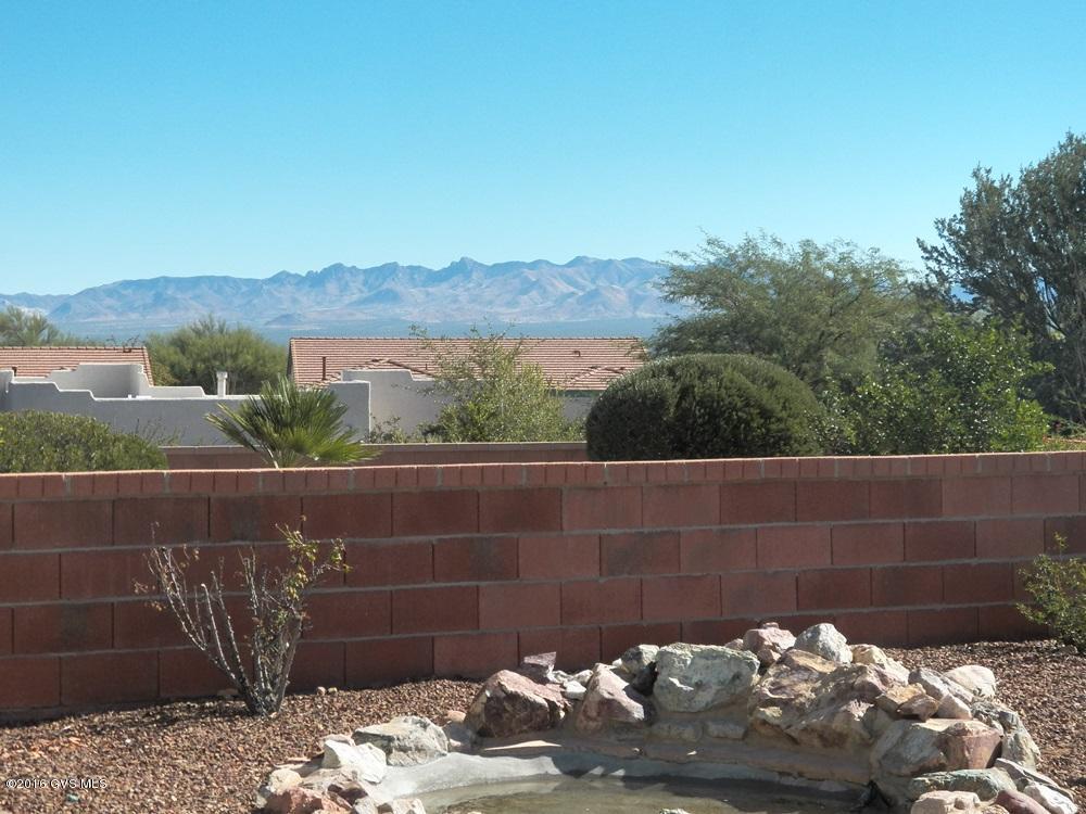 Well designed, compact 2BR 2BA single family home, built in 1998, providing the privacy you want on your patio while enjoying wonderful valley and mountain views. Listen to the tranquility  the soothing water feature, the rustling of quail. Away from traffic, centrally located in a newer subdivision with a state-of-the-art rec center. The must have interior features are great room, split bedroom plan, neutral dcor, tile floors in all the right areas, large laundry room, walk-in closet and dual vanities in the master bedroom suite. Do not forget the large, epoxy coated 2-car garage. Give this home serious consideration.