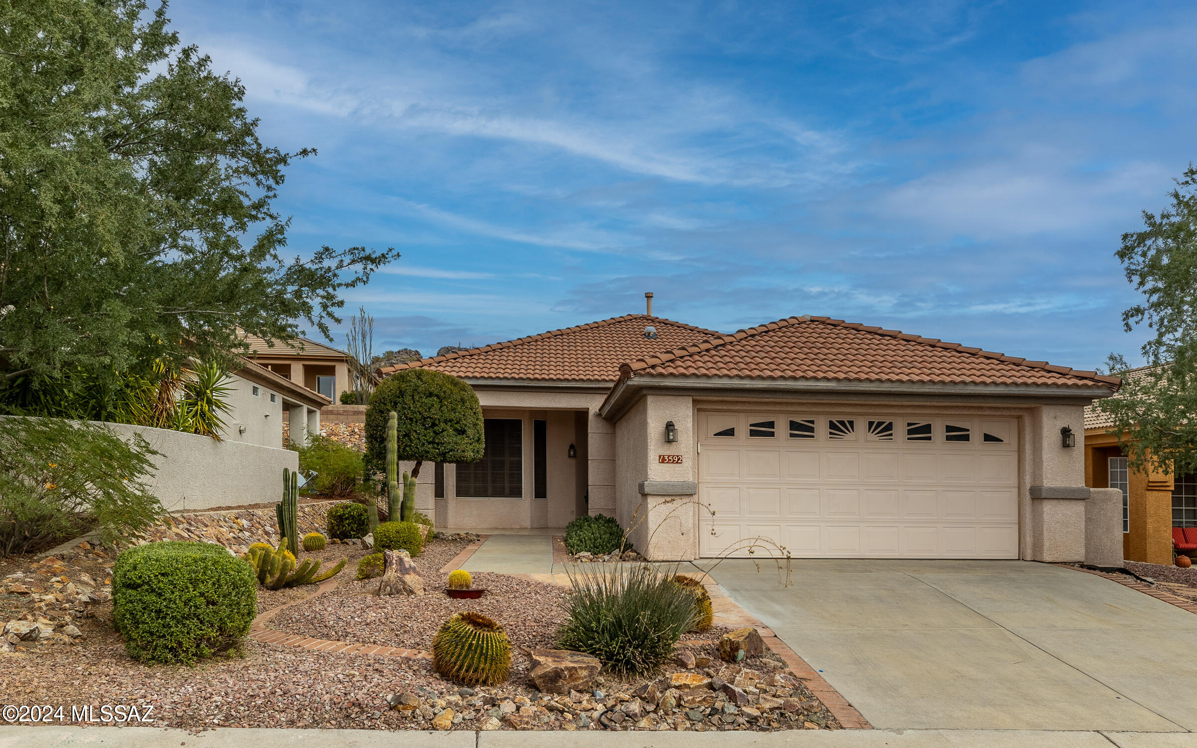 All tile flooring & plantation shutters  throughout this Durango floor plan home. Upgraded kitchen cabinets w/stainless steel appliances - all convey. Stylish/updated lighting/fans in several rooms. Guest bedroom has bay window for extra space. Well manicured landscape front & rear. Fully fenced backyard. Owned outright solar system. Average monthly electric bills under $40/mo.  Many upgrades over the past several years. New dishwasher installed 2025. Home is ready for quick move-in if desired. Home has a one year termite warranty - treatment performed March 2025. 85% of furniture in home is available on separate Bill of Sale. Clean crisp home.  Easy access to Clubhouse.