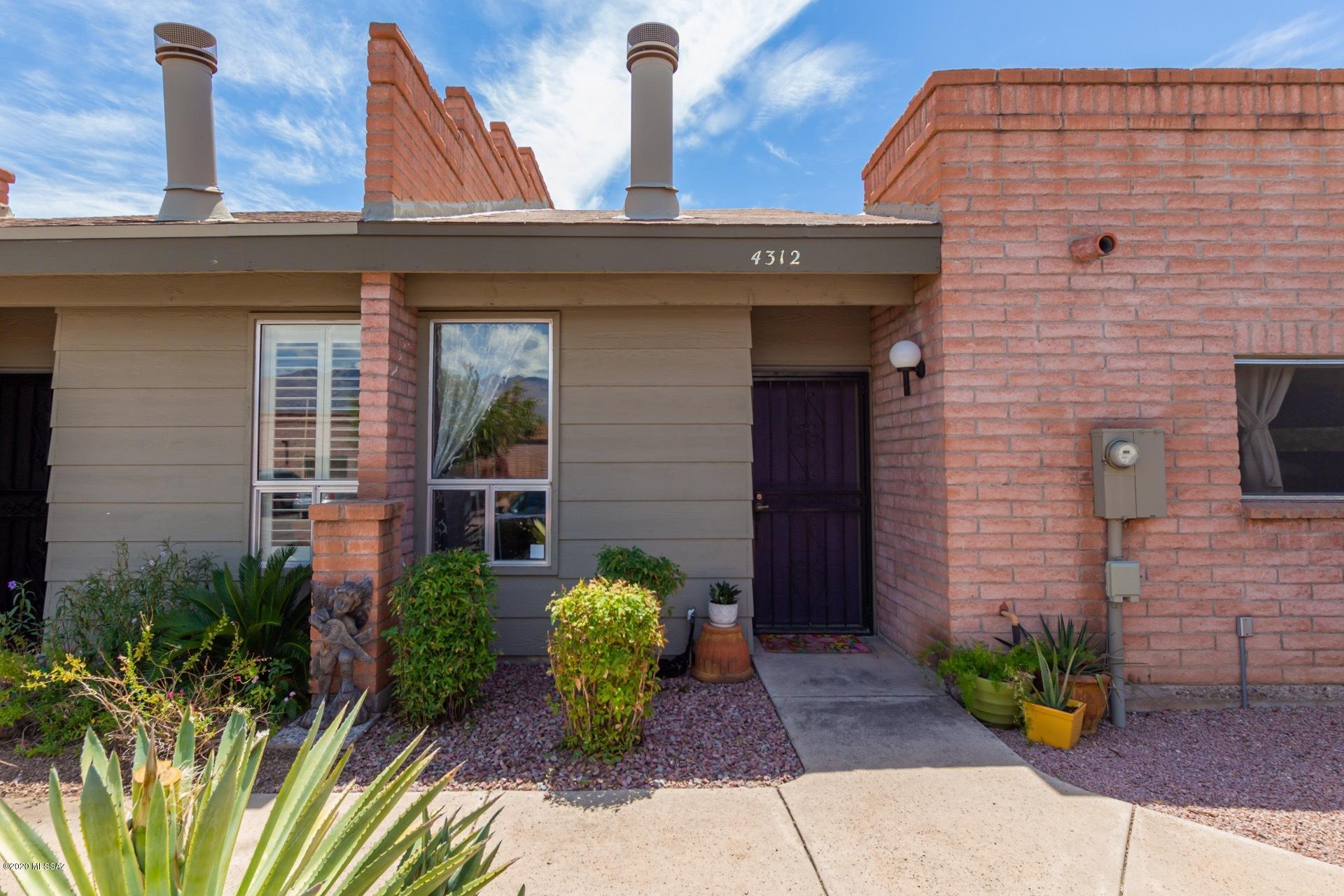 WELCOME HOME!! Absolutely enchanting central town home waiting for you!  You'll enjoy the modern updates done in true style, from the newer tile, updated interior paint all the way to the decked out kitchen! This home boast a loft that can be used as an office or a possible guest retreat, creating more space. Located in a quiet community with a pool, spa as well as being nestled in the heart of Tucson. We all know this home wont last, schedule your showing today!
