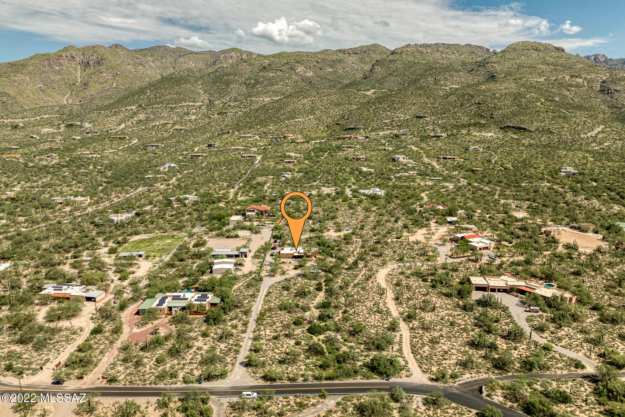 Motivated Sellers........

This custom home sits on 3.33 acres in the most desirable part of Tucson in the Tanque Verde Valley with peekaboo lights of the city. Located on the NE side of town with 360 degree views, homes like this are a rarity. Sets back from the road, this 2,666 square foot home provides privacy and serenity. Pulling up to the home, the circular driveway and fountain offers a welcoming site. The home itself includes a long list of upgrades including three completely remodeled bathrooms, several new windows and doors, new countertops, new flooring, and more! The 12-foot tongue and groove and exposed beam ceilings in the living and family rooms, connected by a central see-through stacked stone fireplace, give the feeling of being in a cozy lodge.

The covered patio provides close views of the Catalinas and a spectacular spot to watch the monsoons' role in. Sellers are offering concessions for interior paint to give you the opportunity to make the home your own. There is already ample cleared space on the property to add horse facilities, a shop, or whatever you might want. All of this is in the award winning Tanque Verde School District and close to trails, shopping, dining, and even golf! Don't wait, this home won't last long.