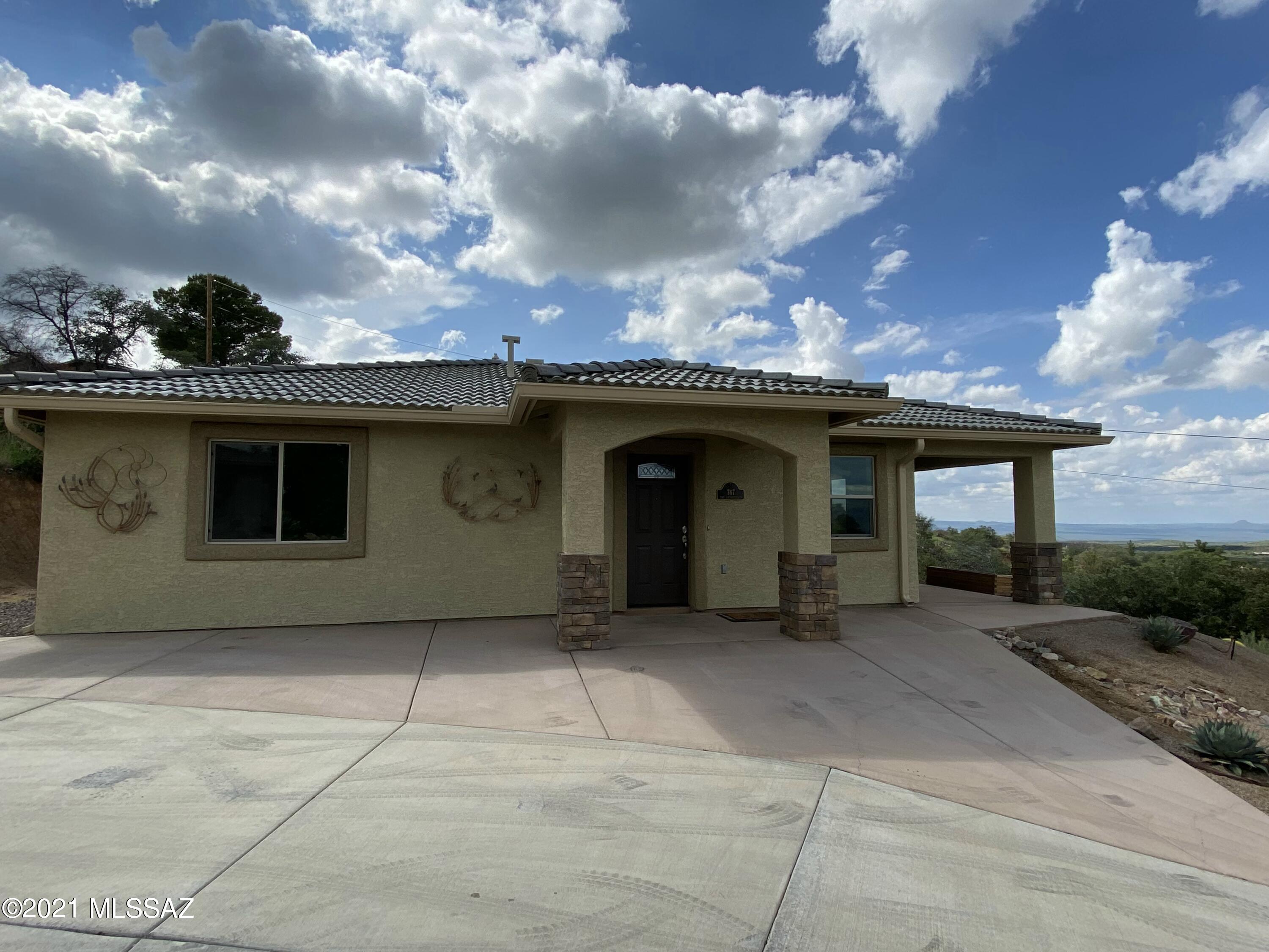 Beautiful newer Mediterranean style home built in 2019. 
Living and kitchen area have large picture windows to stunning view.  Double doors take you to a nice covered patio to sit out and enjoy the view, morning or evening! 
The kitchen has granite countertops, cabinets with soft-close doors, island and pantry.  Also has a dishwasher and trash compactor. Two bedrooms with a Jack and Jill bath featuring a double vanity, walk-in jetted tub with overhead shower. Gazebo included to enjoy a meal with a view.