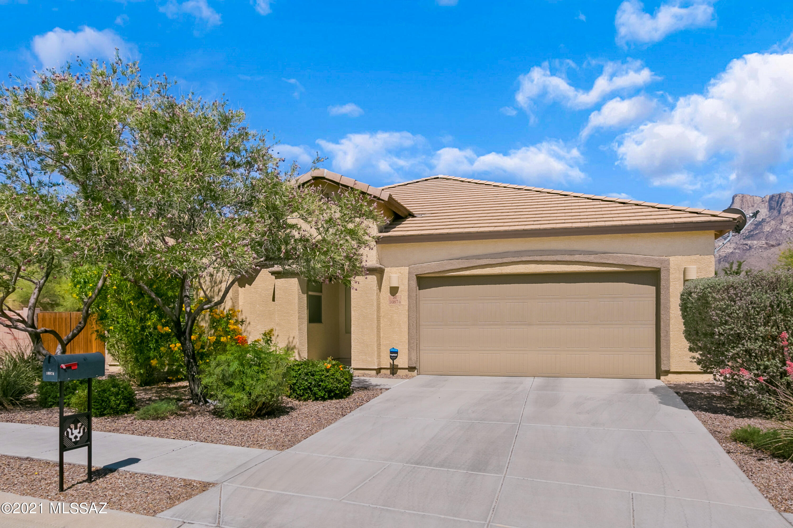 Welcome home to your new 3 bedroom, 2.5 bathroom home! This beautiful home has been well maintained and showcases breathtaking mountain views! Inside, the home features neutral paint, tile flooring and plush carpet in all the right places. Your stunning eat-in kitchen has ample cabinet space, stainless steel appliances, granite countertops, a walk-in pantry and a large island for preparing delicious meals. The powder room is convenient for hosting guests. Your master bedroom features a walk-in closet, double sink vanity and a separate tub and shower. Each of the additional bedrooms are amply sized for the whole family! Step out to your spacious backyard! The covered patio is an excellent place to enjoy the cooler evenings and stunning mountain views! The mature trees and desert plantings allow for easy yard maintenance!  Don't miss out on this fabulous home. Schedule your showing today!