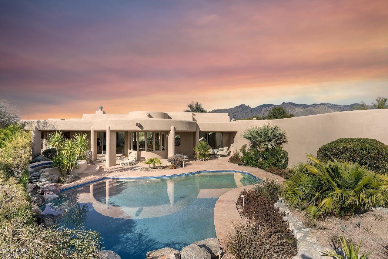 Hacienda Del Sol Estates...Spectacular City & Mountain Views. Rare...Original owner & First Time on the Market in one of Tucson's most sought after, gated neighborhoods. Over 4,200 sq. ft. of single level living...Immaculate...Open Floor plan, 4BDRM/3.5BA, Office, 2 Fireplaces, Pool/Spa patio...1.1 Acres...3 car garage & more.