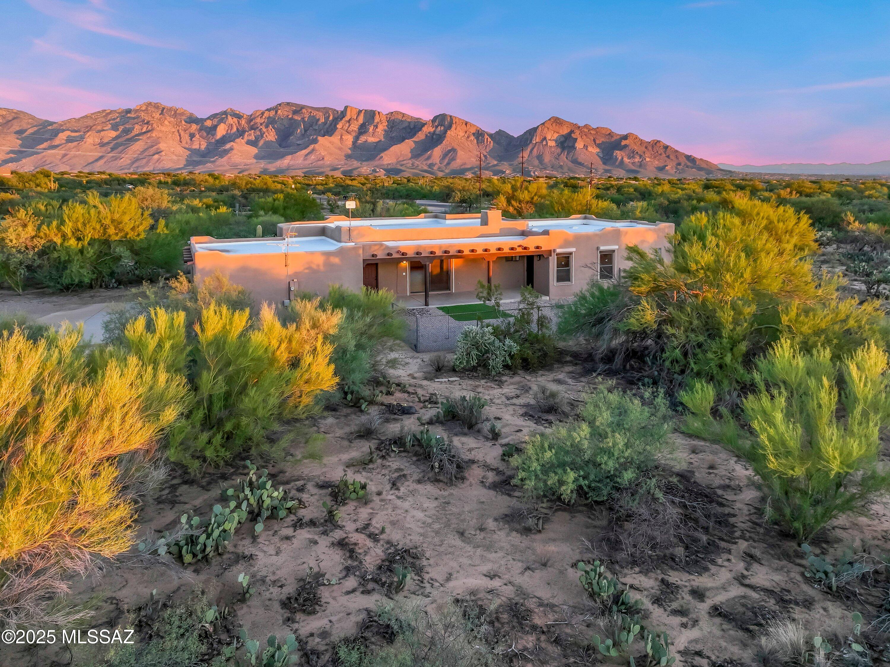 Move in ready 3BR/2BA custom home with 2,326 square feet on 6.91 Acres in La Cholla Airpark. This property is perfect for aviation enthusiasts and equestrian lovers alike. Zoned for horses and offering plenty of room for an RV, this property combines luxury, function, and freedom. Your foyer entry opens to a large living area with a built-in wood-burning fireplace and adjacent formal dining room, perfect for entertaining. Enjoy cooking in this custom kitchen with decorative wood cabinetry, granite countertops and backsplash. The breakfast nook has amazing mountain views you can take in while you are enjoying your morning coffee. The primary bedroom is your own private retreat and more.  Horse property for your dream equestrian facility. The primary bathroom has dual sinks, soaking tub and a large walk-in shower.  Covered Rear Patio: Accessible from the garage, great room, and primary bedroomideal for relaxing or entertaining while taking in the desert serenity. New HVAC system and all applainces stay. The oversized 2-Car Garage offers additional space for storage, workshop needs, or hobby equipment.  Stay connected with fast internet available at La Cholla Airpark (Independent provider).