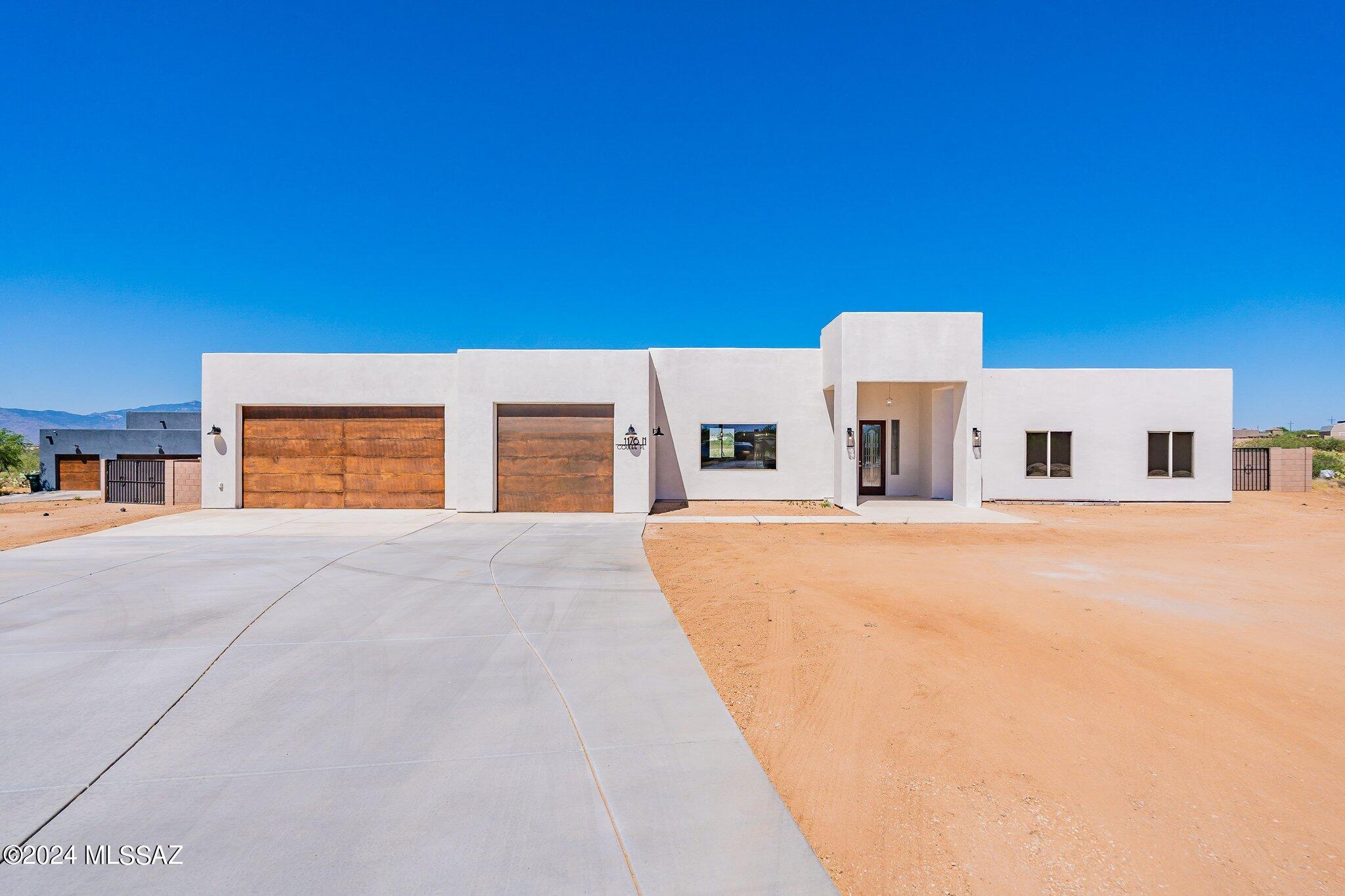 New construction home! NO HOA! Toys, boats, RVs, allowed! This gorgeous home in Vail sits on .99 of an acre of beautiful land. At 2714 sq ft, there are 4 beds, PLUS A DEN, 3 baths & a 3 car garage. The open concept kitchen has beautiful custom cabinetry, a large breakfast bar, and a stainless steel appliance package, canned & pendant lighting & under cabinet lighting. The master bedroom features patio access, a huge master closet & a stunning on-suite bathroom with dual vanities, custom tiled walk in shower, glass door. Incredible TONS OF EXTRAS, upgraded custom cabinetry, tile accent walls, extended master shower, two drive through gates, extended driveway, and more! 1 GB fiber optic avail