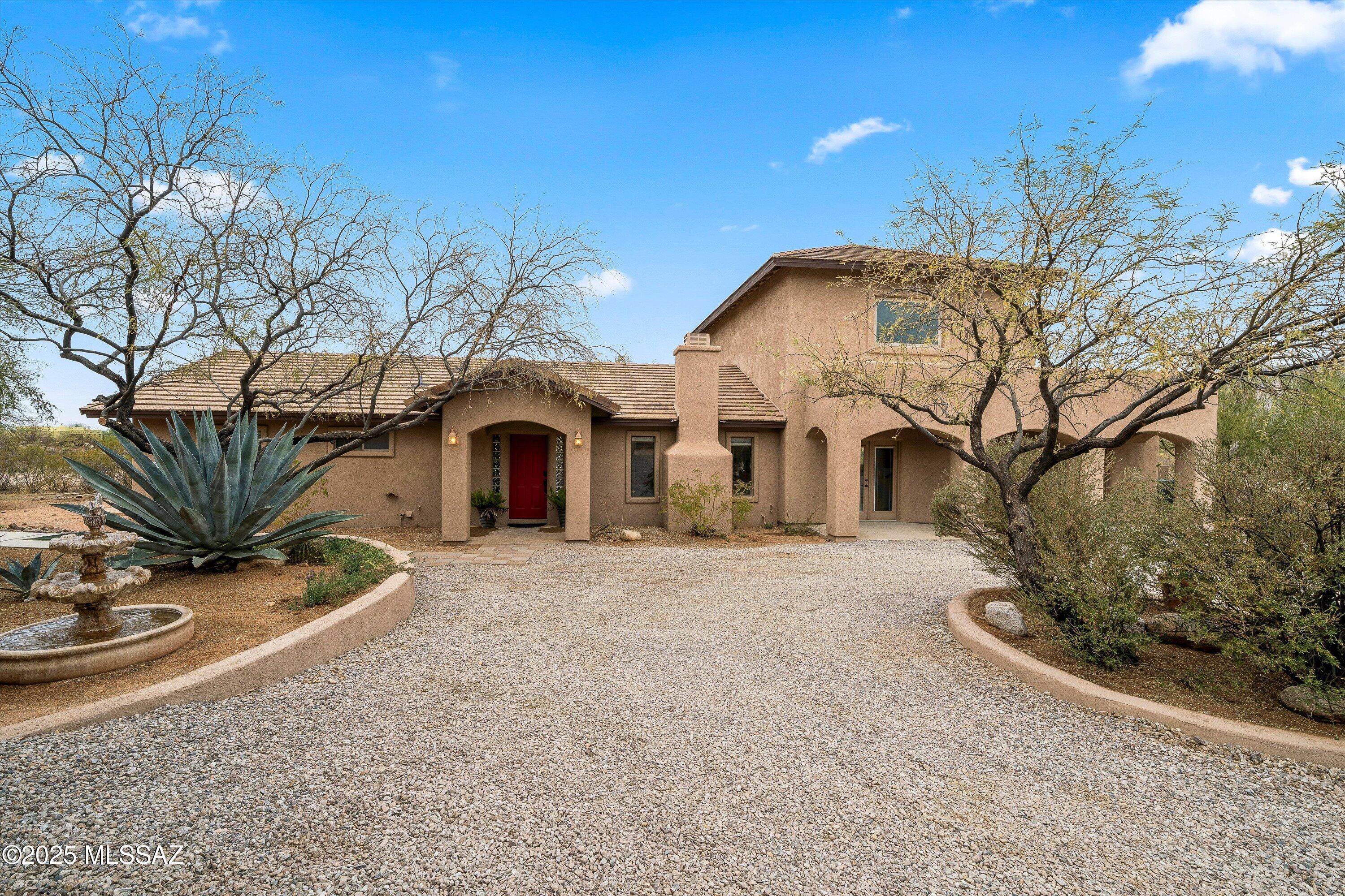 PRICE RANGE: $800,000-$825,000. 
Exceptional Value on 1 Acre! This 3,876 sq ft property offers a main home with 3 beds, 3 baths, a den, and a 3-car garage, plus a 2-bed, 1-bath guest house—all on a private, no-HOA lot. The main home features soaring ceilings, a spacious kitchen with granite countertops and deluxe appliances, and a luxurious primary suite. Step outside to a multi-tiered outdoor space with mature trees and stunning mountain views. Located near Saguaro National Park, with biking and hiking trails just minutes away. This property offers outstanding value in today's market, combining spacious living with income-generating potential. At 3,876 sq ft, the main home features 3 bedrooms, 3 baths, a den, and a 3-car garage with workshop, offering plenty of room for families, workspaces, or hobbies. The high-end finishesincluding granite countertops, a deluxe gas range, and double ovensadd long-term value to the home, while soaring ceilings and mountain views make the space feel open and airy.

The primary suite offers a private retreat with French doors leading to a balcony, dual vanities, a large soaking tub, and a walk-in shower. With its private, tranquil setting, the suite provides a high-end experience for the homeowner. The multi-tiered outdoor space features mature trees, a grass area, and sweeping mountain views, making it an excellent space for relaxation, entertaining, or future improvements. With no HOA restrictions, the expansive backyard is ready for enhancements such as a pool, garden, or workshop.

The 2-bed, 1-bath guest house is a highly desirable feature, adding additional living space or offering a lucrative income opportunity. It includes a full kitchen, a wraparound patio, and a fireplace, providing comfort and privacy for renters or guests. Whether used for long-term rentals, short-term stays, or visiting family, the guest house adds immediate and flexible value. With its own private entrance, it's well suited for a variety of uses.

Located in the award-winning Vail School District, this property offers families access to excellent education and community services. The location is also minutes away from Saguaro National Park and Colossal Cave Mountain Park, offering easy access to biking and hiking trails and outdoor recreation. The desert surroundings provide a peaceful, private environment while maintaining proximity to Tucson, increasing convenience and long-term value potential.  

Whether you're looking for a home with room to grow, space for extended family, or an income-generating asset, this property delivers.  This is a rare opportunity to own a spacious, private home with built-in income potential in one of Southern Arizona's most desirable areas.