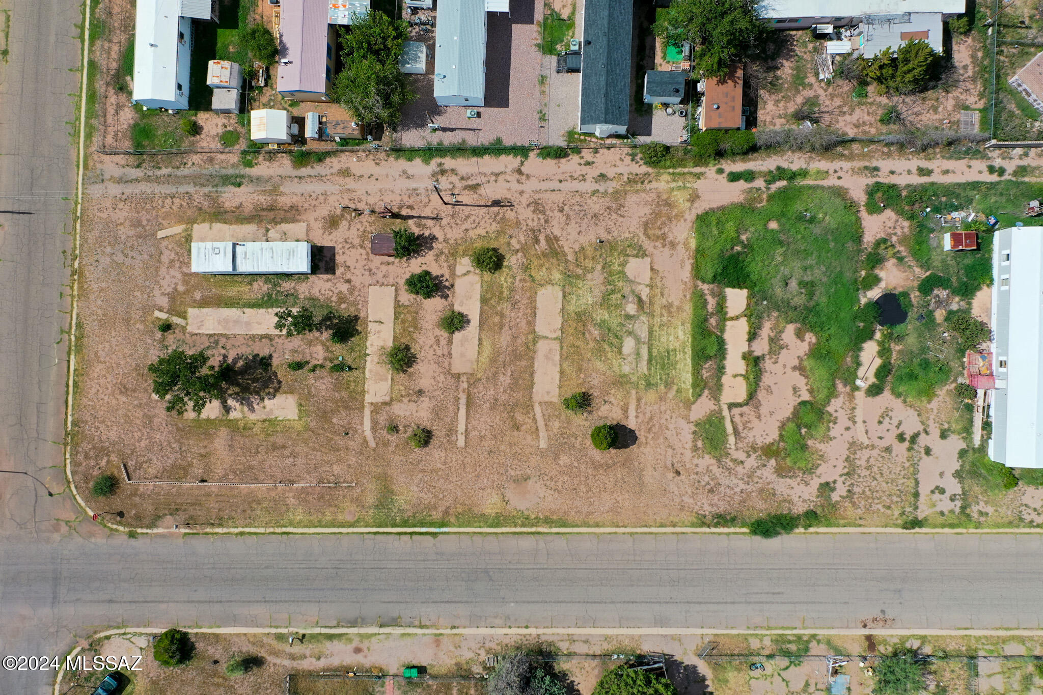 EXCELLENT OPPORTUNITY for investors. This one of 2 available (300 E Pima St) MULTI-FAMILY or SFR zoned. NO MOBILES allowed anymore. Property being sold AS IS. Mobile home currently on the property will convey AS IS. Utilities are at the property but must be confirmed depending on the desired development of the property.