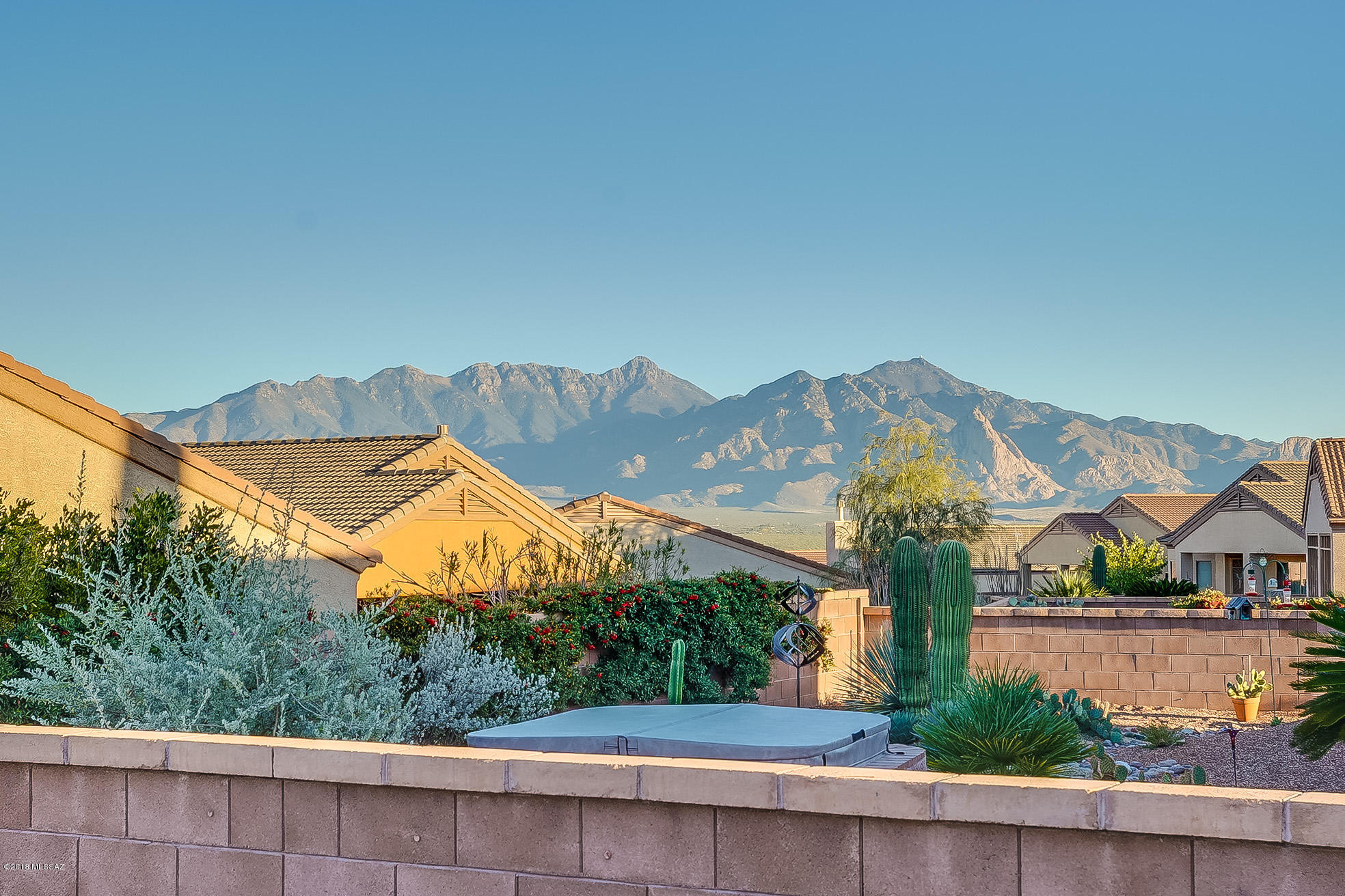 BEAUTIFUL HOME WITH LOVELY MOUNTAIN VIEWS! Extremely well maintained, this Fastidious Property has been tastefully remodeled. In the Kitchen you'll enjoy Granite Counters, SS Appliances and stylish Lighting above/below the Cabinets; and the Master Bath has been completely upgraded. You'll enjoy Diagonal Ceramic Tile throughout; attractive Recessed Lighting; and a handy Murphy Bed in the Roomy Den. The Open Floor Plan/Great Room is light/bright with many large windows, and features a welcoming Gas FP, giving you ambience and comfort. The Extended Garage easily stores your larger vehicles, and the Back Patio, which features those Gorgeous Views, abuts a large Common Area, where you'll have plenty of Privacy/Wildlife Viewing. This unique property is priced to sell/easy to tour: a real gem!