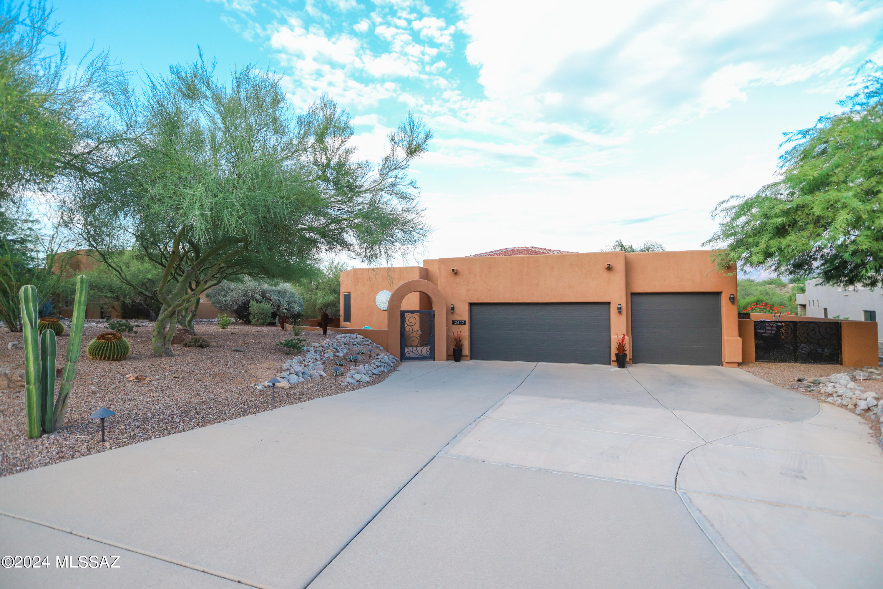 Are you kidding? Nope! This home with incredible views is back on the market—only because the buyer's financing fell through. Welcome to a home that dares to be different, designed for those who embrace the unique. Enjoy breathtaking sunset reflections over Pusch Ridge, a thoughtful multi-level layout that offers privacy and connection, and an entertainer's backyard with ann outdoor kitchen, pool, 2 fireplaces, citrus trees and artificial turf. Spacious 3-car garage, kitchen with views, and priced below comps! A rare opportunity in Oro Valley!