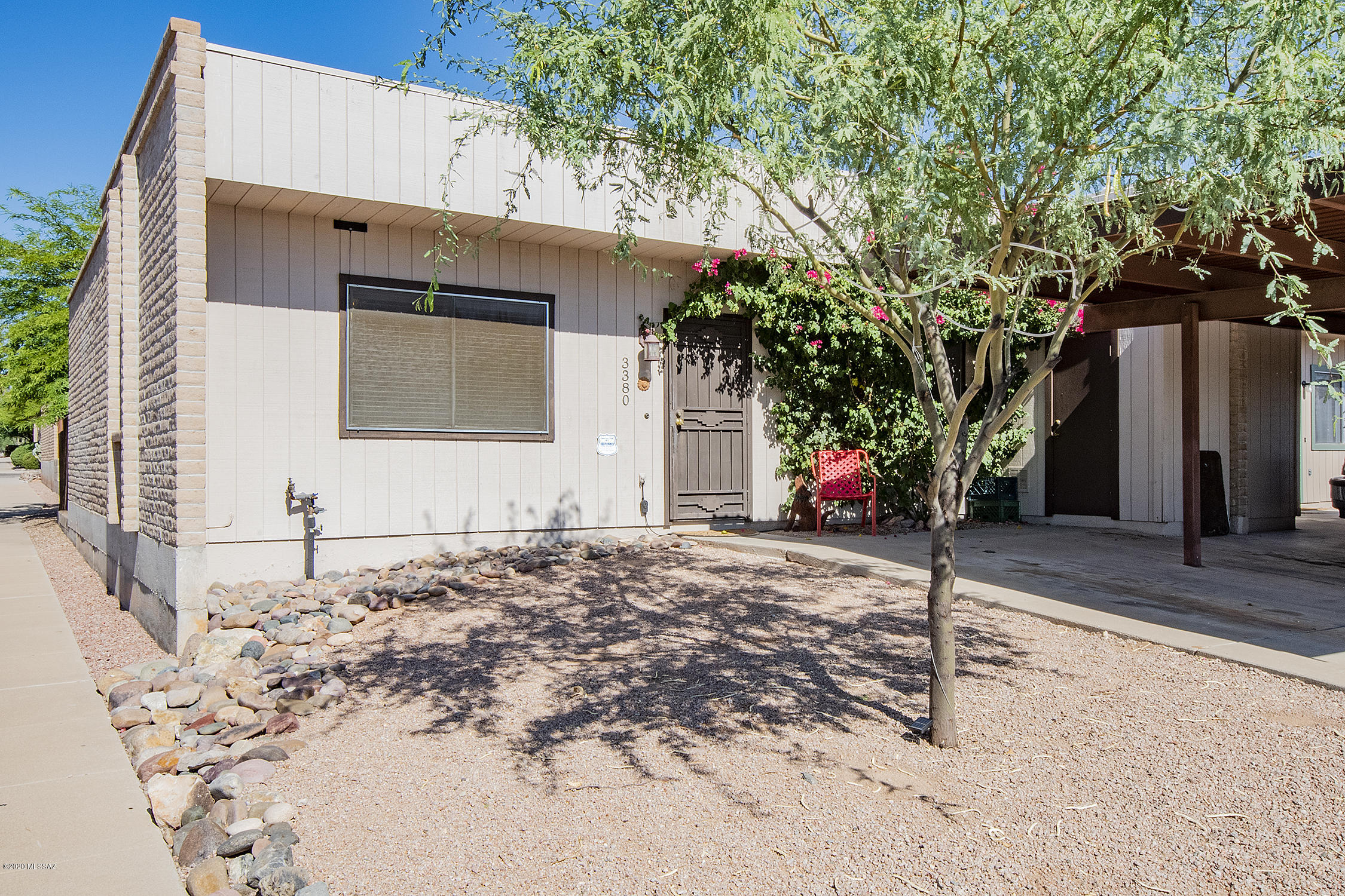 Beautiful Home on Large corner lot at the entry of the cul-de-sac with Gorgeous sunrise views!  This 3/2 bath home with private backyard and access to community pool will not will not disappoint! Super close to bus lines, schools, Pima/U of A