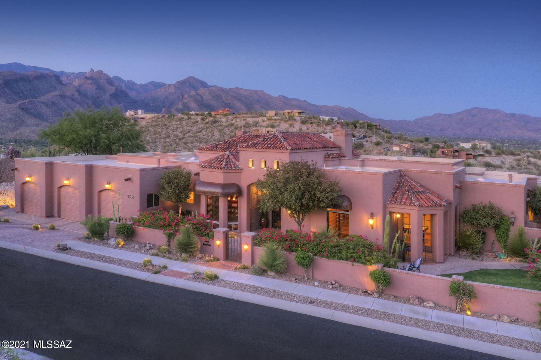 Stunning Tuscan style home on top of ridge w/breathtaking city & mt views in prestigious gated Sabino Mountain. Front gated crtyrd w/dramatic wrought iron front entry door & lush landscaping. Exquisite Greatroom w/high ceilings, elegant fireplace, flr to ceiling built in bookcases w/ladder, French door opens to magnificent patio, formal dining rm w/beam ceilings, gourmet island kit w/granite countertops, stainless appliances, gas stove top, 2 dishwashers,pantry,brkfst area, beautiful brick flrs, rec rm w/bar,4 BR's&4 BA's, mstr w/sitting area, fireplace, lux bath, garden tub, lg shower,2 walk in closets, private entry to rear patio, lg laundry rm,3 car gar, wrkshp, guest qtrs/ofc. Resort like bkyd w/cov'd patio, pool, spa, grass, BBQ, outdoor shower, fireplace, the best city & mtn views.