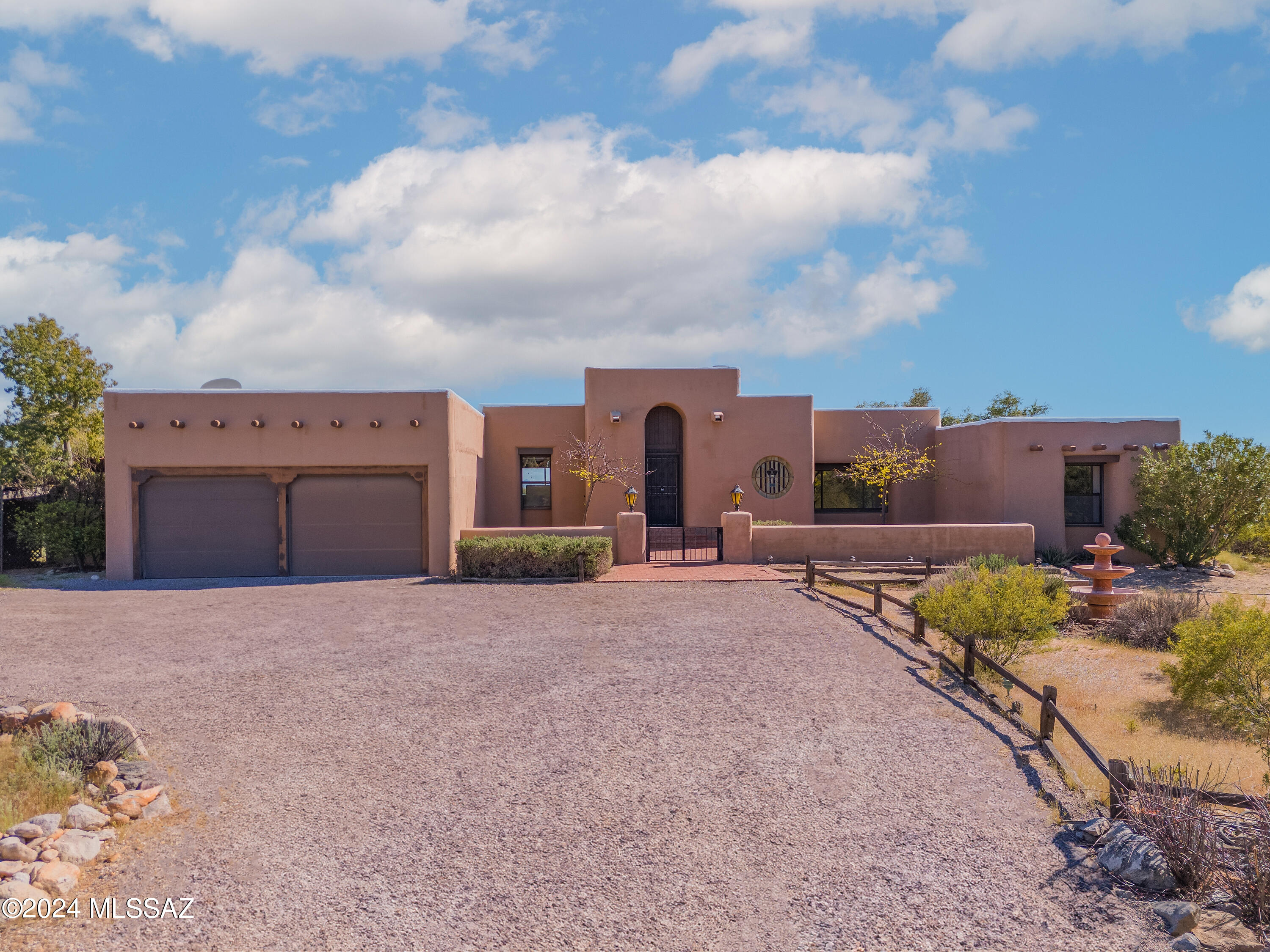 Open House Saturday 4/6 11-1 and Sunday 4/7 12:30-3:00.
Located in the Catalina Foothills Estates No 5, this classic Santa Fe style home features southwest details including exposed viga beam ceilings, brick paver flooring, three beehive fireplaces and other classic SW attributes.  Enjoy Catalina Mountain views from the front yard and expansive sweeping city views from backyard pool area. Property is located at end of cul-de-sac on a private almost 1.5 acre lot. 3-bedroom 3-bath split floor plan.Home is an easy drive to town, and situated in District 16 schools.