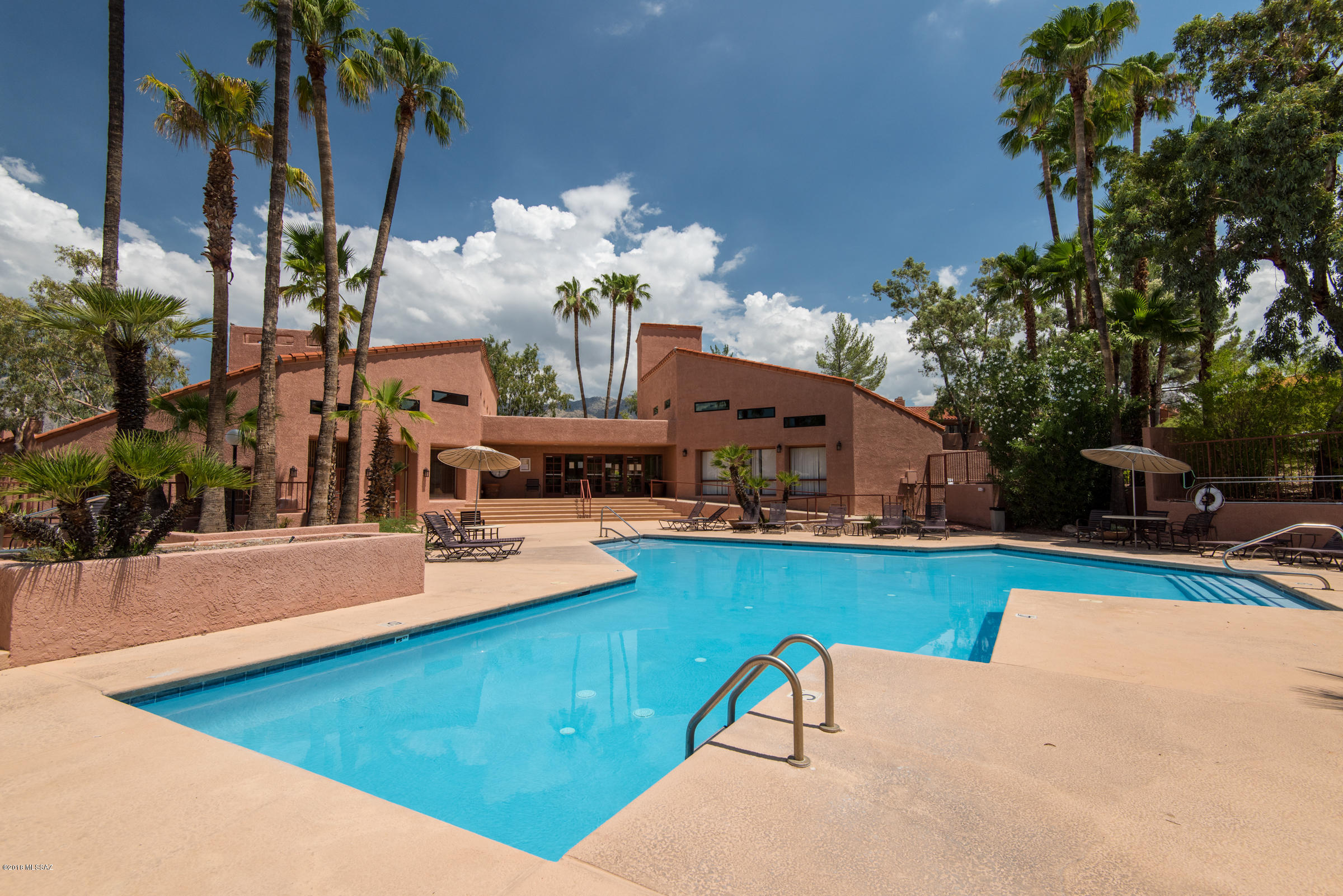 Spacious 2 story Catalina Foothills 2BR + Den/2BA end unit condo in the gated community of Ventana Vista Condos.  This private renovated Northern Tucson property features an open floor plan with high ceilings, wood burning fireplace, kitchen with stainless steel appliances and corian counters, zoned heating & cooling, Catalina Mountain views and a convenient location near shopping, restaurants and Sabino Canyon Park.  The Ventana Vista Condos resort style amenities include a heated pool & 2 spas, enormous clubhouse, exercise facility, gas bbq areas spread thoughout the community, tennis / pickle ball court, gated entryway and park-like grounds.