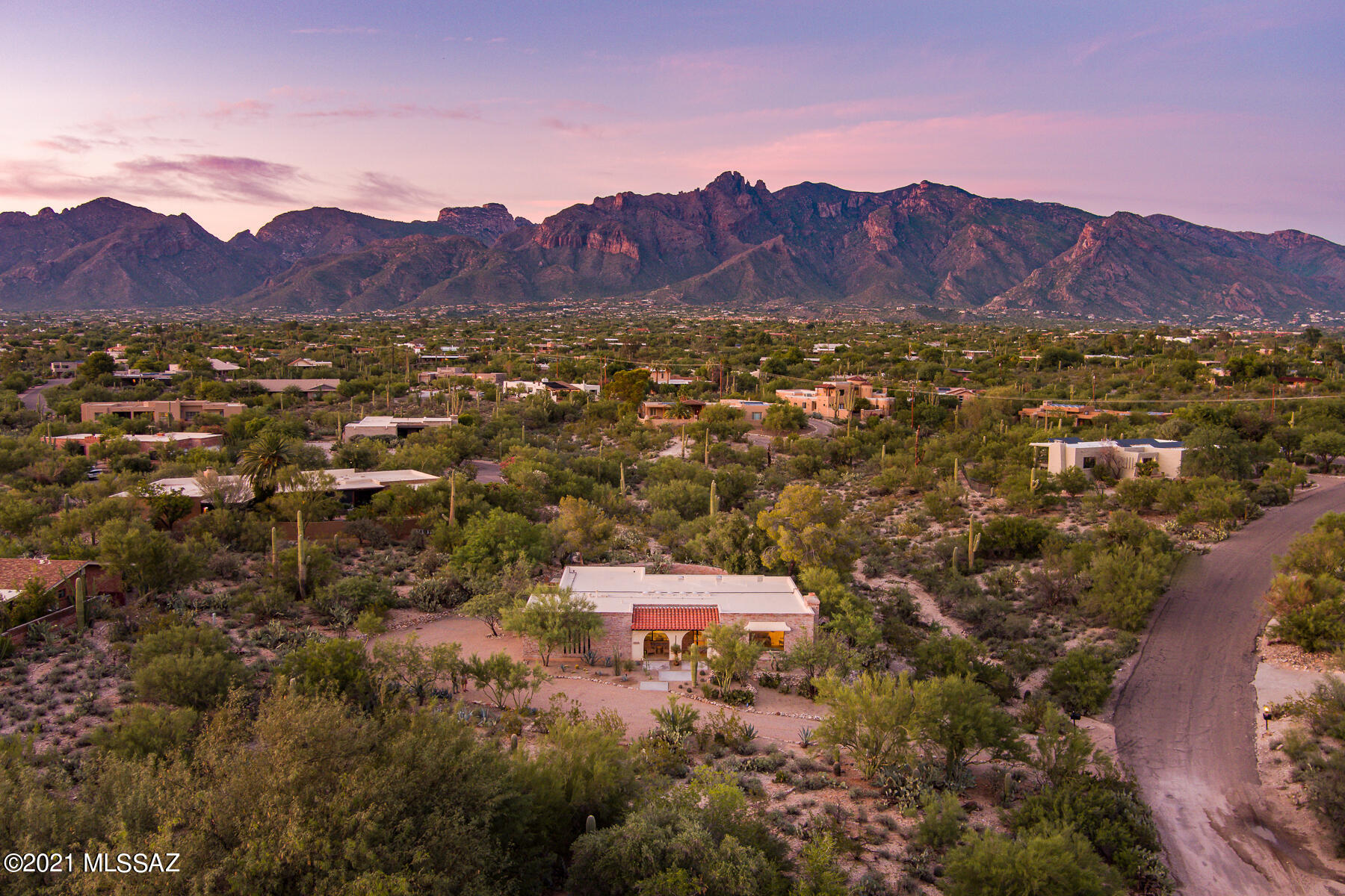 Beautifully renovated desert sanctuary for those seeking exceptional views, privacy, and location.

Sited on just over an acre, the property offers panoramic mountain views, a backyard oasis with a sparkling pool and desert paths that wind throughout. The north and south facing covered patios are perfect for relaxation and entertaining as the home seamlessly transitions between outdoor and indoor living. The layout of the home offers various possibilities, from traditional to a flexible/adaptive use of space (three bedroom plus flex space). 

The renovation has a perfect balance between past and present. Fine harmonious upgrades can be appreciated throughout the home. The newly redesigned kitchen includes custom cabinetry, countertops, new appliances, and a generously sized breakfast bar.

Additional upgrades include: redesigned primary bedroom and bathrooms, concrete overlay in living room, Saltillo floors in bedrooms and baths, all windows, exterior doors, and lighting throughout entire home. 

This modernized burnt adobe epitomizes classic Tucson Foothills living, and is nestled in one of the most coveted locations. The strategic location offers the best of the foothills and the best of in town living, minutes away from both, with access from Campbell and River.  For a breathtaking visit, schedule a sunset showing! 

See video and documents tab for additional information including floorplan, video, and a full list of upgrades.