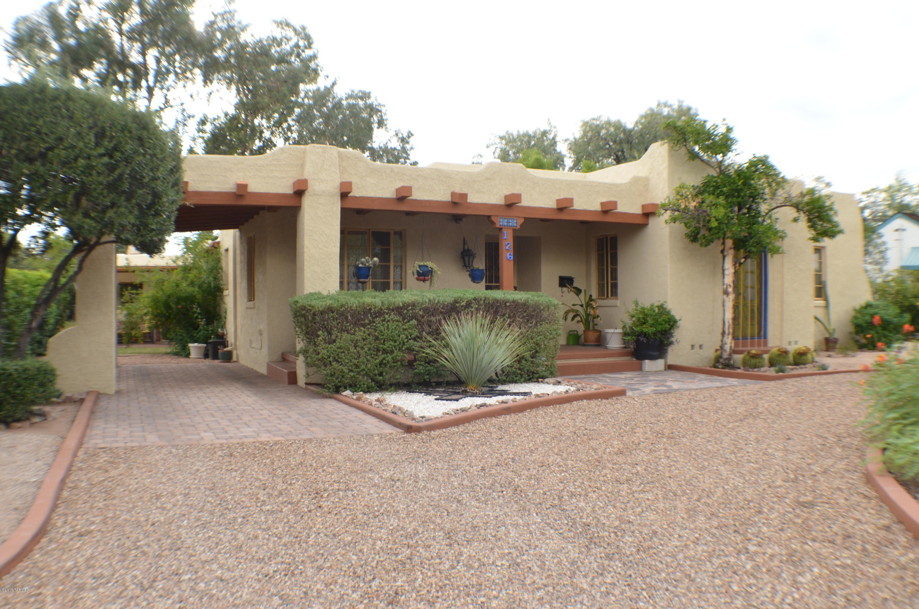 Beautiful 3 bedroom 2 bath house with additional 1 bedroom 1 bath guest house. This home is on a large lot in the distinguished San Clemente neighborhood. Minutes from the El Con Mall, Reid Park, Randolph Golf Course, and the University of Arizona. Many improvements have been done while keeping the charm of a 1940's home. The patio has been enclosed to provide a relaxing Arizona room. Tile and hardwood floors through most of the home make for easy cleaning. Separate breakfast nook and formal dining rooms. Air conditioning to escape the heat and humidity of the summer time. Fireplace to escape the cold winter! The 598 square foot guest house has a separate bedroom and living room as well as a full kitchen, subletting allowed.