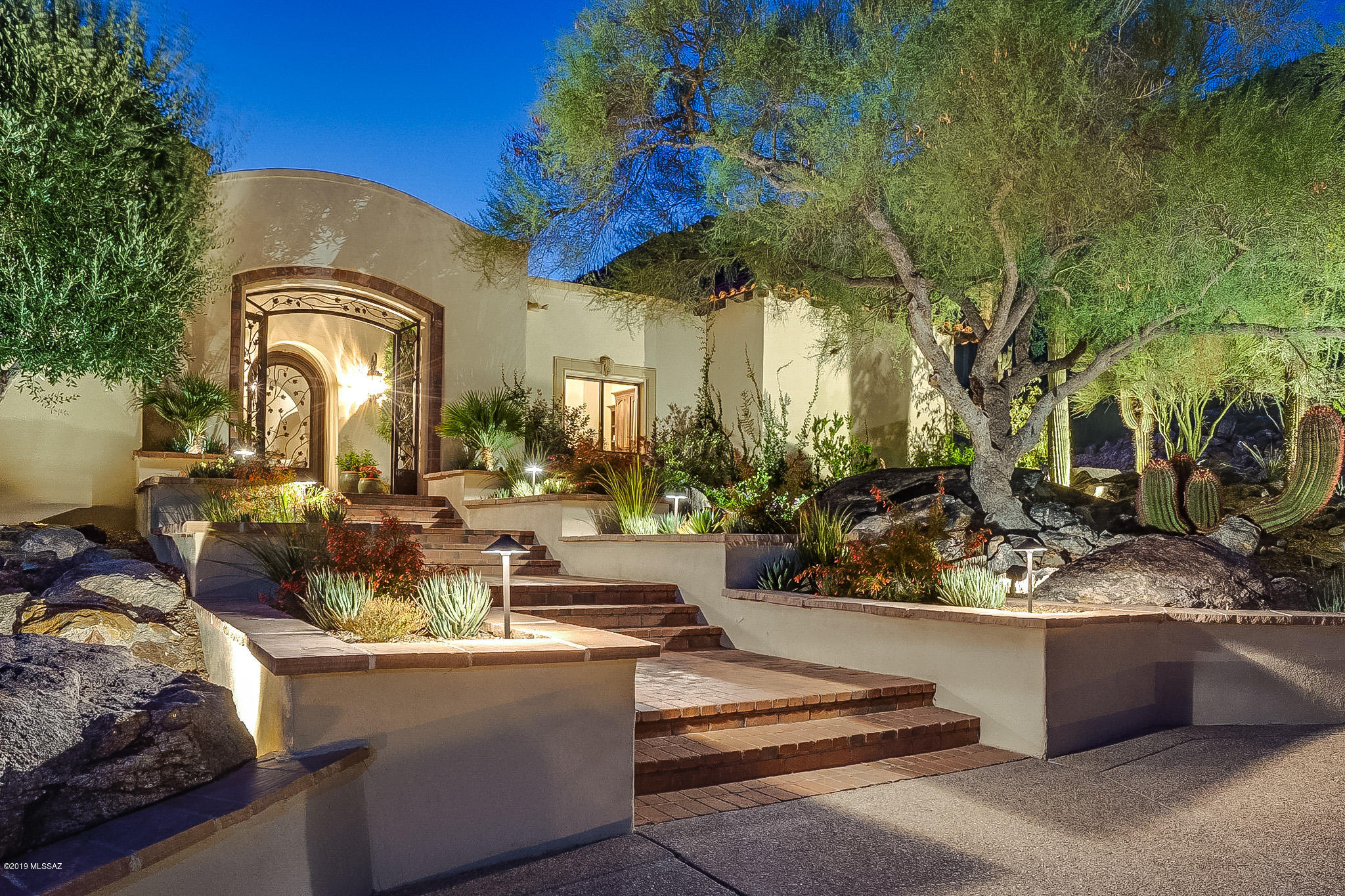 Beautifully renovated & masterfully detailed one-story Santa Barbara style luxury home on coveted 3.7 acre mountain lot in Skyline Country Club Estates.  Enjoy panoramic mountain, desert & sparkling city views.  Architectural splendor & an impeccably executed design welcome you to the foyer/atrium - perfect for entertaining.  Discover domed ceilings, inset floor tile designs, rich paneled doors, beamed ceilings, gourmet kitchen w/custom hood & cabinetry, performance appliances and walnut-top island, handcarved bookcases & bath cabinets, butler's pantry/laundry room, artist studio (office/fitness), 3 fireplaces & much more. Skyline Country Club offers 18 hole golf, tennis, fitness-center, fine & casual dining.  3rd GARAGE/TANDEM POSSIBLE. FURNISHINGS AVAILABLE.