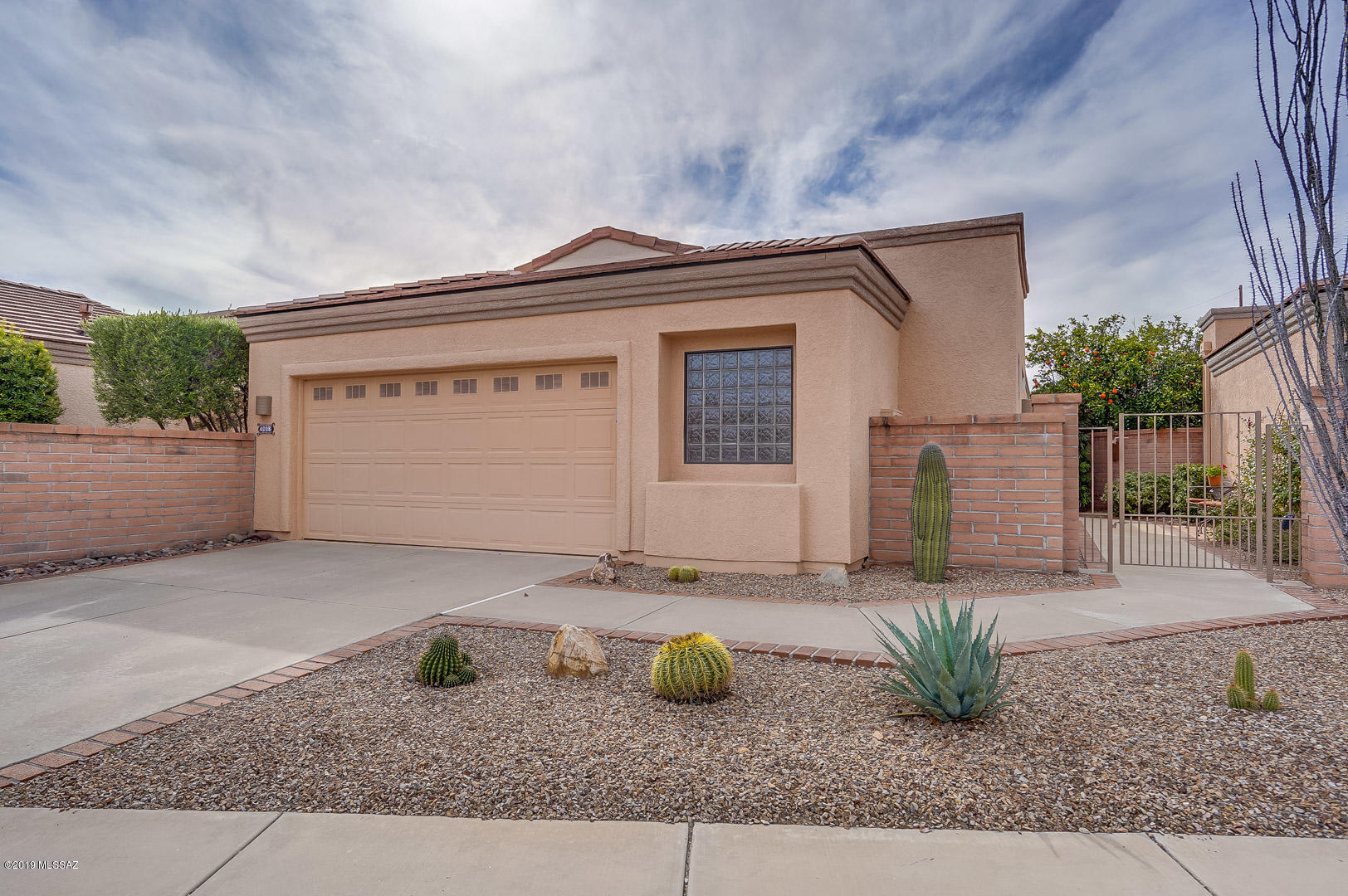 This lovely home has been meticulously cared for and has desirable upgrades and features throughout.  This gorgeous gem features a soothing neutral color palate and stunning porcelain tile floors with custom inlays.  The kitchen offers quartz counter tops, warm birch cabinets and lustrous black appliances.  Unwind from a long day of play watching the beautiful Arizona sun set from your cozy kitchen nook.  The master suite offers dual sinks, crisp quarts counters, an updated tile shower and two nice sized closets.  The guest suite offers privacy and luxury with stunning quartz counters and functional pocket door and views of the stunning courtyard entry.  This is a must see, move-in-ready home with furniture and decor available via separate bill of sale.