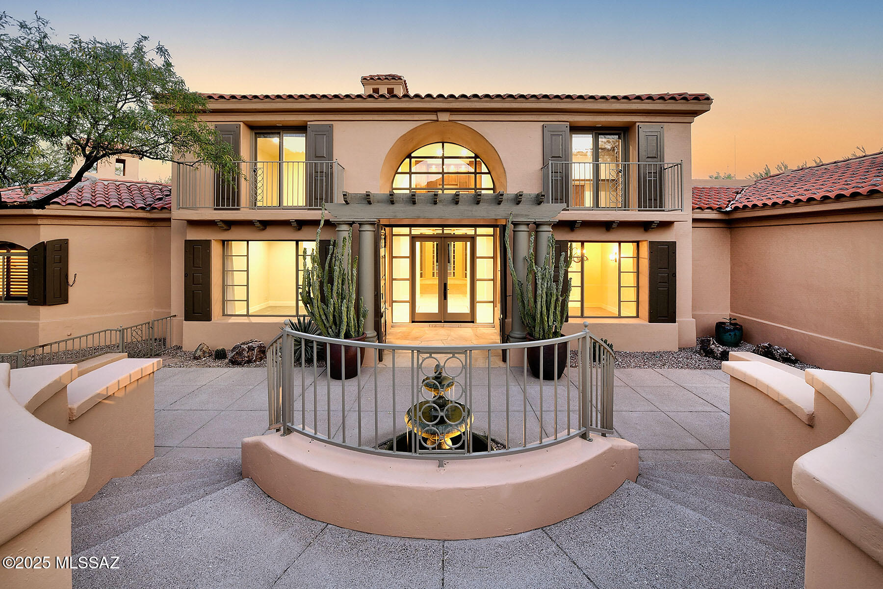 Nestled in the heart of the Catalina Foothills, this exquisitely remodeled Mediterranean-style residence offers a harmonious blend of classic elegance and modern luxury. Spanning 3867 square feet, this home features three bedrooms and three bathrooms, including two distinct primary suites - one on each level - providing versatile living arrangements. The upper-level primary suite is a sanctuary of comfort, boasting a spacious bedroom, an expansive sitting area, custom cabinetry, a built-in microwave, and a mini bar and refrigerator. The interiors are adorned with 24 x 24 Egyptian limestone travertine flooring, lending a timeless and sophisticated ambiance throughout. Complementing this area are Caesarstone Quartz Bath Suite Countertops gracing the first-floor bath suite, second floor countertops and flooring, and laundry room, reflecting a commitment to quality and style. A notable feature of this home is the inclusion of a private elevator, seamlessly connecting both levels and enhancing accessibility. The property is situated in a serene desert setting, offering panoramic views of the surrounding landscape. Residents of this exclusive enclave enjoy proximity to the Ventana Canyon Golf and Racquet Club, renowned for its Tom Fazio-designed golf course, as well as access to scenic hiking trails and the tranquil beauty of the Sonoran Desert. This residence embodies the essence of refined desert living, combining architectural beauty with modern amenities in one of Tucson's most sought-after communities.