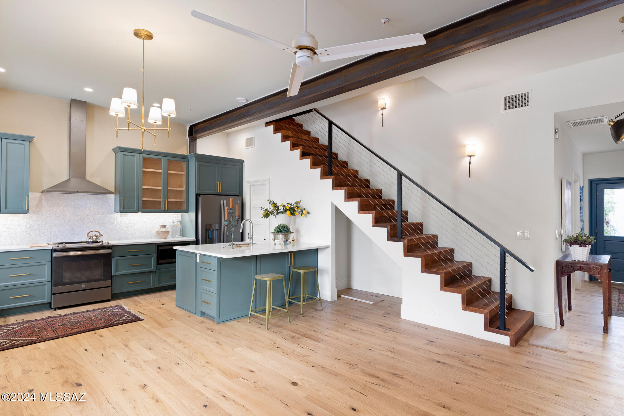''The Balcony'' earns its name from the sweeping covered balcony overlooking Scott Street & A Mountain PLUS a long enclosed porch for added living enjoyment. Impressive exposed brick arch is just one of many striking  historic elements. Repurposed original materials blend w/luxe modern amenities incl custom soft-close wood kitchen cabinets, GE Slate SS appliances, elegant Visual Comfort & Robert Abbey lighting throughout, Riobel & Hansgrohe fixtures, heated primary bath flooring, custom solid walnut floating vanity, a Villeroy & Boch floating vanity, fully restored historic clawfoot tub. Floor plan gives private access to guest suite or home office! Triple brick construction on the bottom level & double brick on top= unmatched quality in this incredible new living experience!See DOCUMENTS See Documents Section for Taxes Explained & Historic Property Tax program
