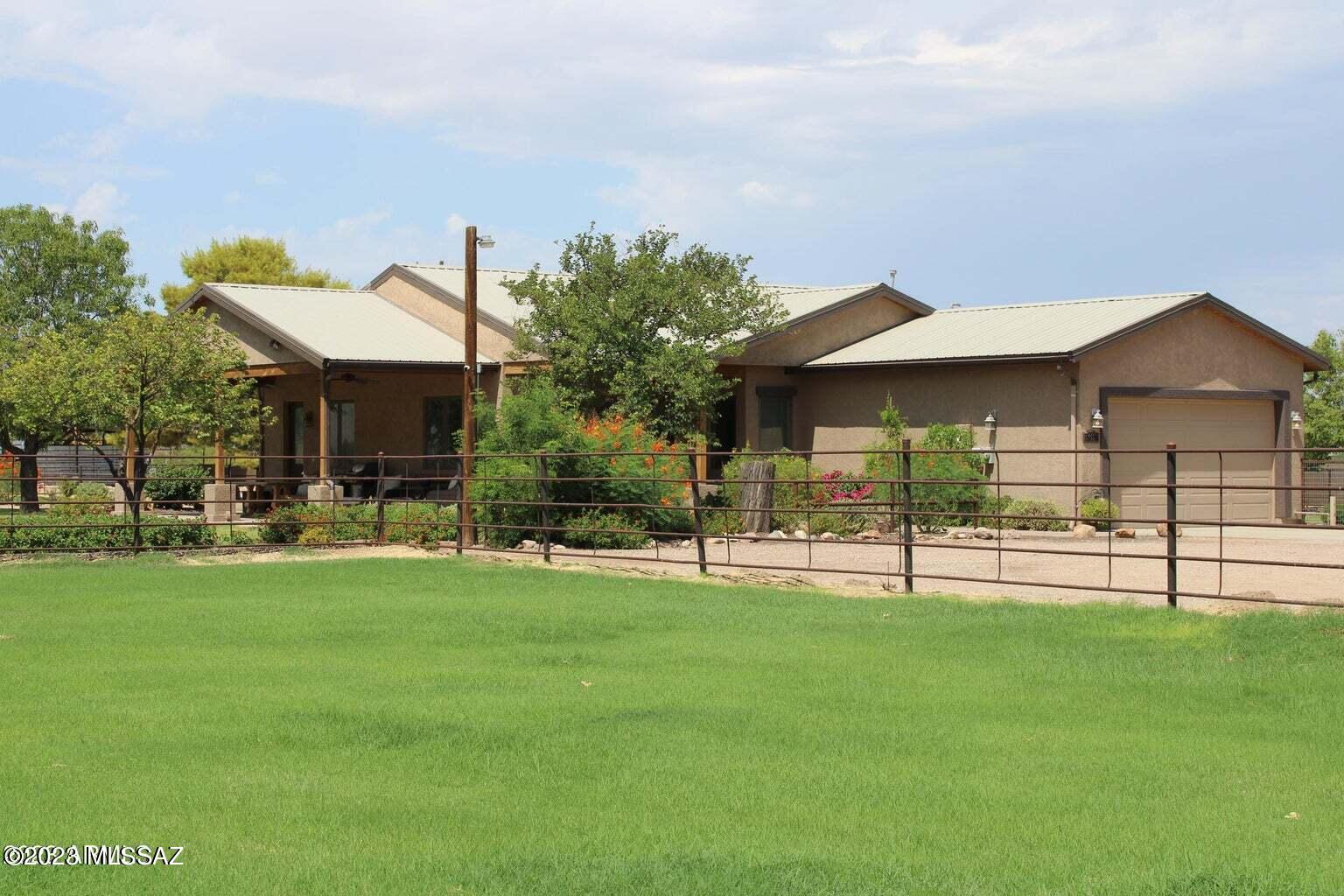This 3.5 irrigated acre property offers 2 legal homes w/ seperate addresses & utilities. Multiple income opportunities via rentals of the mobile home, apartment in the shop, shop space, 2 full RV hookups, and 9 horse stalls. Horse amenities include irrigated pastures, covered stalls, tack rooms, separate feed rooms & arena (140x200). Wash adjacent to the property and just a few doors down is the the popular Queen Creek Wash Trail, perfect for miles of trail riding. Gorgeous views of the San Tan Mountain! Low power bills w/ OWNED Solar Panels. Here's the best part—it's a newer home, built in 2013, which means modern amenities and energy-efficient features throughout! All this & minutes to Horseshoe Park & downtown Queen Creek with shopping, dining & Phoenix-Mesa Gateway Airport.
