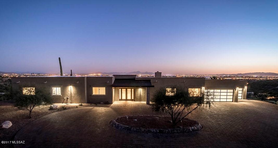 Stylish Soft-Contemporary with Panoramic views. Set on a prime Foothills ridge-top, this sleek home has been completely Renovated and Re-Designed. Fine natural stonework, with Canterra accents and large scale Travertine floors. Incredible style and impeccable craftsmanship. Sleek and modern kitchen opens to the spacious, yet cozy Family Room with large Canterra Fireplace, custom shelving and beamed ceilings. Dramatic views of several mountain ranges from the large backyard. Pool, Spa and large patios invite you outside to enjoy the majestic vistas. Stylish glass Garage Doors add personality to this updated and re-imagined property. New Brick Paver circular driveway. New mechanical systems. All new cabinetry, Granite counters throughout, custom paint with accent walls, etc. Owner/Agent.