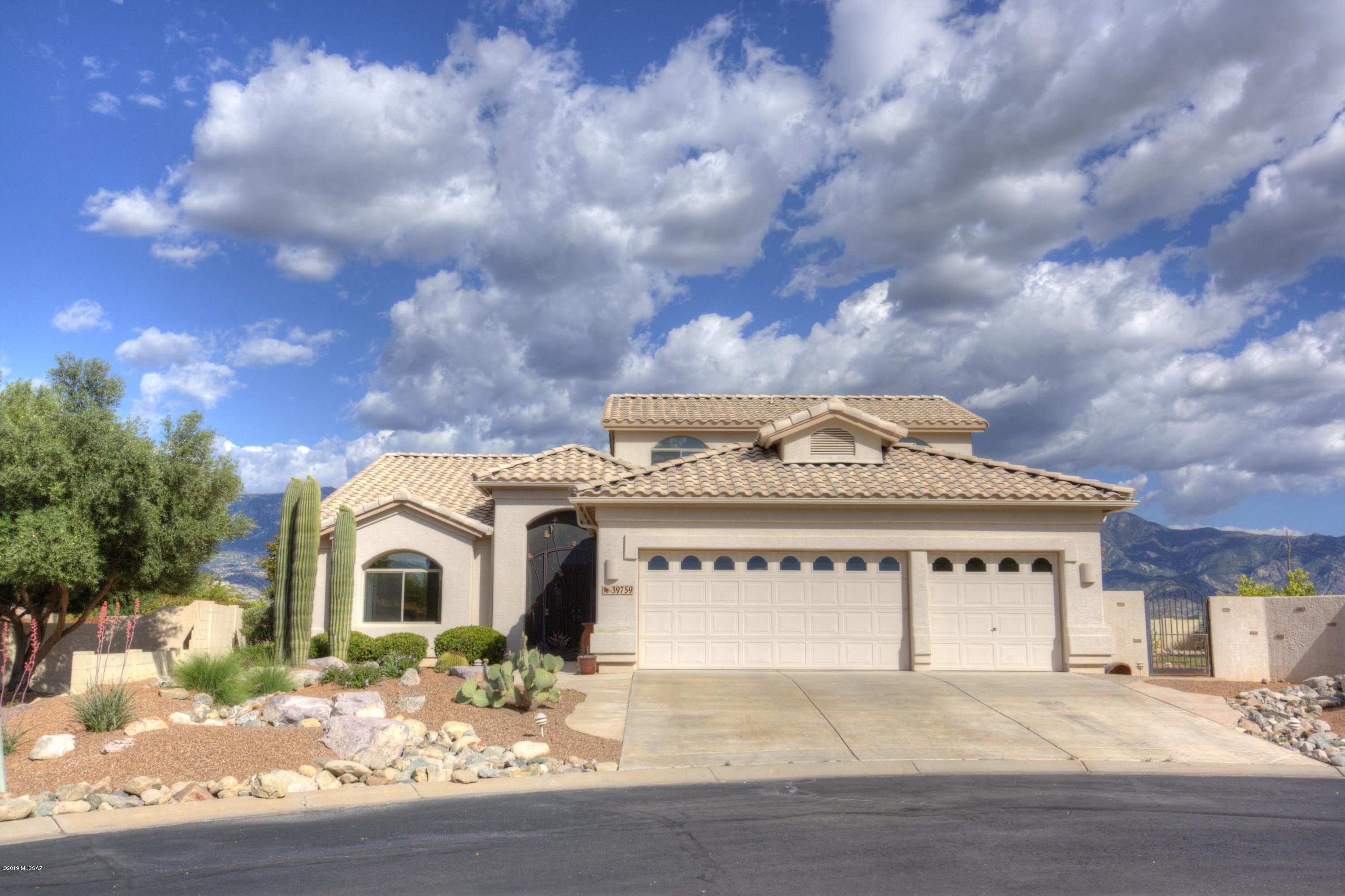 Updated Durango on a large lot with views of the Catalina Mts. Stylish interior has been totally remodeled. French country kitchen with custom cabinets, granite counters, a huge island and new stainless steel appliances with Dacor gas cook top.  Beautiful 20 inch diagonal tile grace the entire main level.  Updated master bath with custom cabinets, Silestone counters and new fixtures. The Resort backyard features a new paver patio, a saltwater pool & spa with waterfall. Gas stub for barbecue, new drip irrigation system and a large side yard.  Premier view lot in a cul-de-sac near fitness, theater, tennis, dog park and soft ball field.