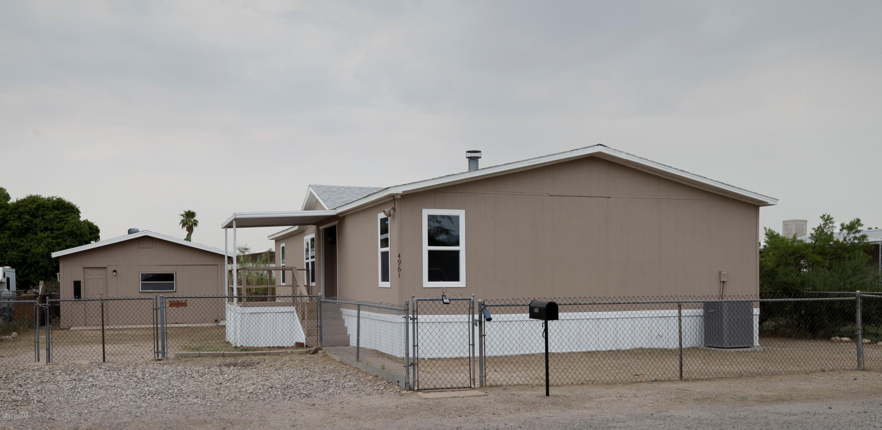 Updated 3 bedroom, 2 bathroom manufactured home. Freshly painted inside and out. Remodeled kitchen and bathrooms with granite counter tops in kitchen. New cabinets throughout. New carpet in bedrooms. New HVAC and water heater.  Very recent roof.  Lots of space and large lot. Extra out building for shop or storage.  Lots of space for rv or boat. Financing is VA or non standard conventional.  Owner will consider a carryback with 20% down, 6% interest and a 5-7 year stop.   owner/agent