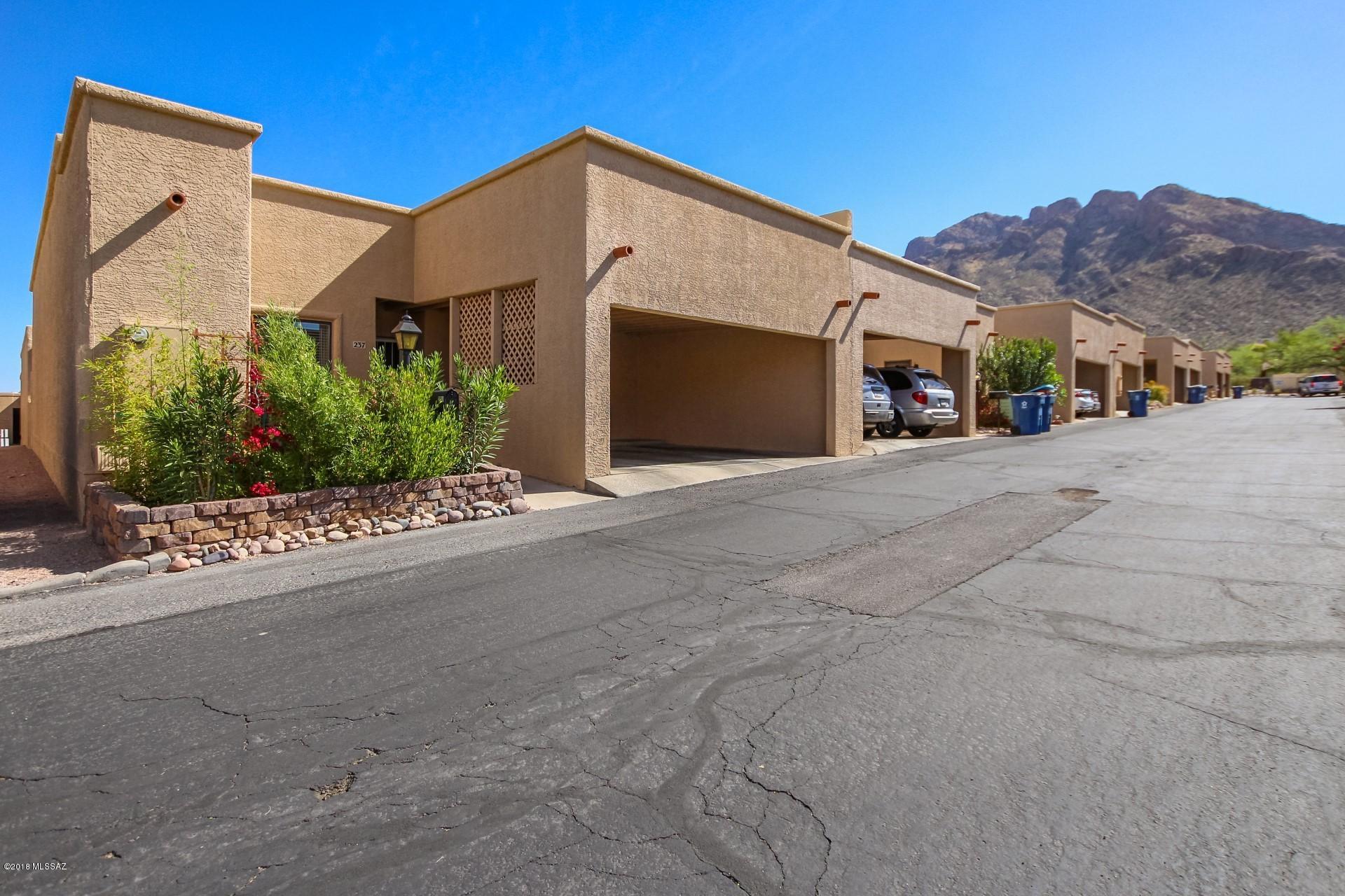 Seller will accept or counter offers between $169,900-$175,000. Pristine in & out! Great Oro Valley TH near all amenities. Light, bright 3BR/2BA with 6 skylights and tall ceilings. Superb floor plan with ceramic tile and wood in all living areas. Eat-in kitchen with stainless dishwasher, microwave and glass top oven. Heat pump replaced in 7/2014. Updated light fixtures. New exterior paint. Show with confidence, act fast, won't last!
