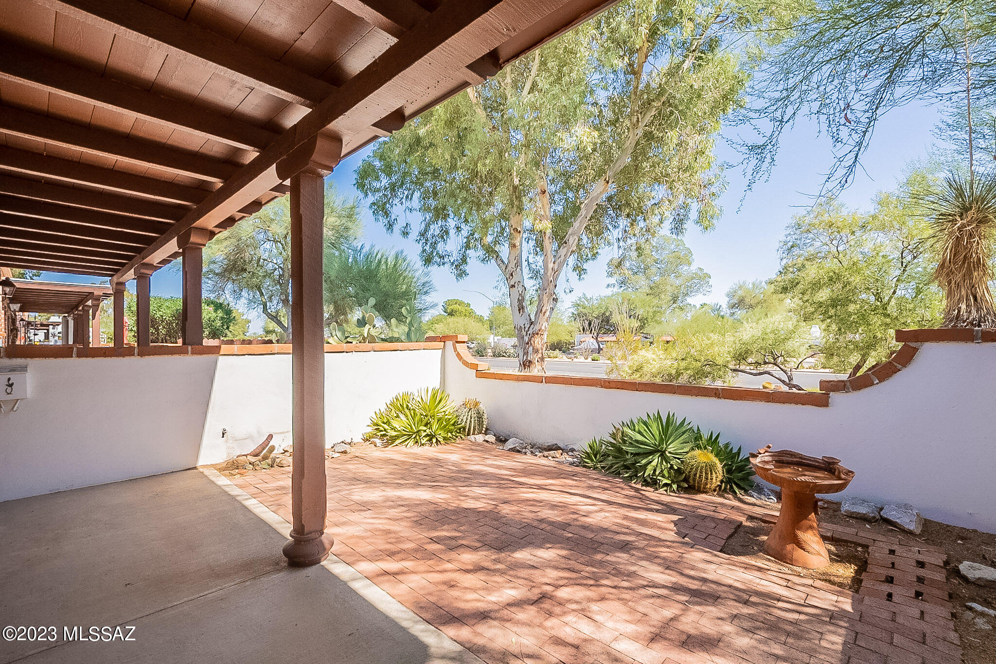 Beautiful end unit in the highly sought after Villas West. Enjoy the sweet mornings on your private brick paver patio. This home boasts a spacious floorplan with ceramic tile throughout. Enjoy ease of access to your laundry in your private shed off the rear of the home. Reserved parking at your doorstep. The community offers shuffleboard, 2 pools and beautiful greenspaces to enjoy the outdoors. This Villa is ready for you to move right in!
