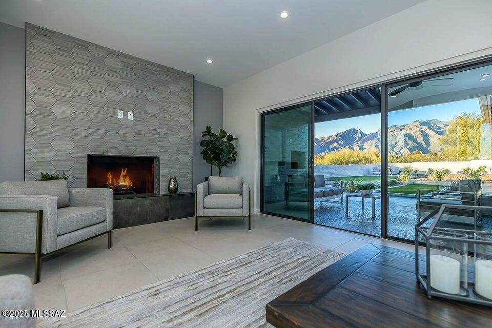 SIMPLY SPECTACULAR, fully remodeled ''ranch'' style home on PHENOMENAL, large 1.66 ac lot in Flecha Caida! STUNNING TRANSFORMATION of this special 1960s burnt adobe w/ the ''WOW FACTOR!'' Every detail upgraded: from under slab sewer lines to new electrical/plumbing, HVAC, windows/doors, flooring, kitchen & baths!  Truly MAJESTIC MOUNTAIN VIEWS & INCREDIBLE PRIVACY! Gorgeous white kitchen w/ granite & quartz counters, Bertazzoni appliances (including gas stove/wine frig), elegant marble tile accents, dreamy island w/ breakfast bar, HUGE pantry & cozy eat-in area. Living room has fabulous tiled fireplace, opens to amazing covered patio w/ outdoor kitchen/bbq. Stylish 2'x4' Italian ceramic flooring thru-out! Each bathroom dazzles! Wonderful patios & outdoor spaces to relax & enjoy! (Continue. Light, bright modern vibes, a nod to its Midcentury modern roots! Kitchen opens to inviting family room, perfect for hanging out & entertaining. Specialty lighting/fans, incredible closets/storage, oversized garage, & amazing paver driveway--EVERY DETAIL ENHANCED INSIDE & OUT!  A SUPERB hilltop winner w/ perfect NORTH/SOUTH orientation & unobstructed VIEWS! Convenient location so close to EVERYTHING! District 16 schools.