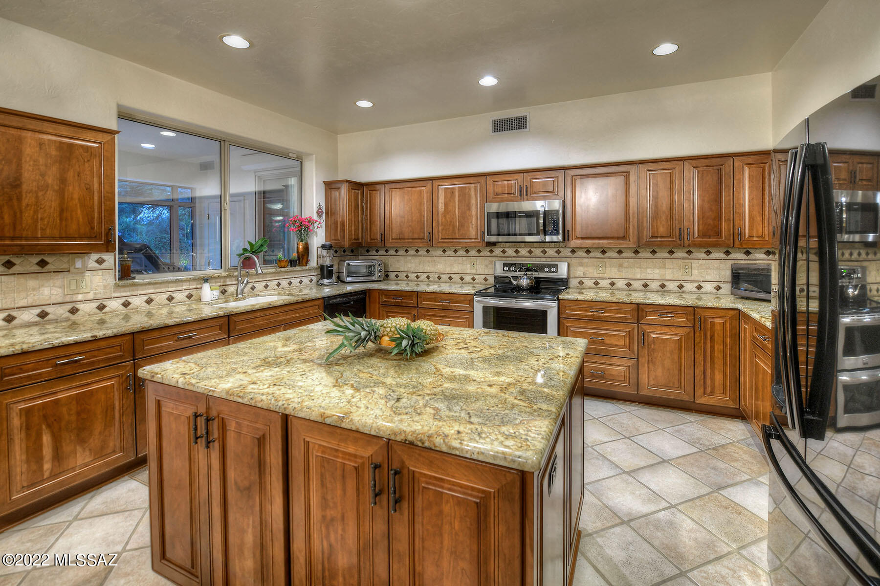Luxurious, 2 story 4-bedroom 3.5 bath home in the beautiful Lakes at Castle Rock gated community. Soaring ceilings with solid wood saddleback staircase welcomes you home. The fully re-modeled kitchen features alderwood cabinets, granite countertops, soft close drawers, huge island, pantry & lots of storage. An enclosed AZ room with sliding glass doors leads you to the private backyard with flagstone patios, built in BBQ & 4-tier garden fountain designed for outdoor entertainment. The oversized Primary Suite located on the 1st floor has a 6 ft soaking tub, enclosed steam shower & 2 huge walk-in closets. On the second floor you find 3 generously sized bedrooms, 2 baths & a private balcony overlooking the heated pool & spa. Downstairs also has a powder room & laundry with cabinets & sink.  Lots of outdoor & indoor storage.