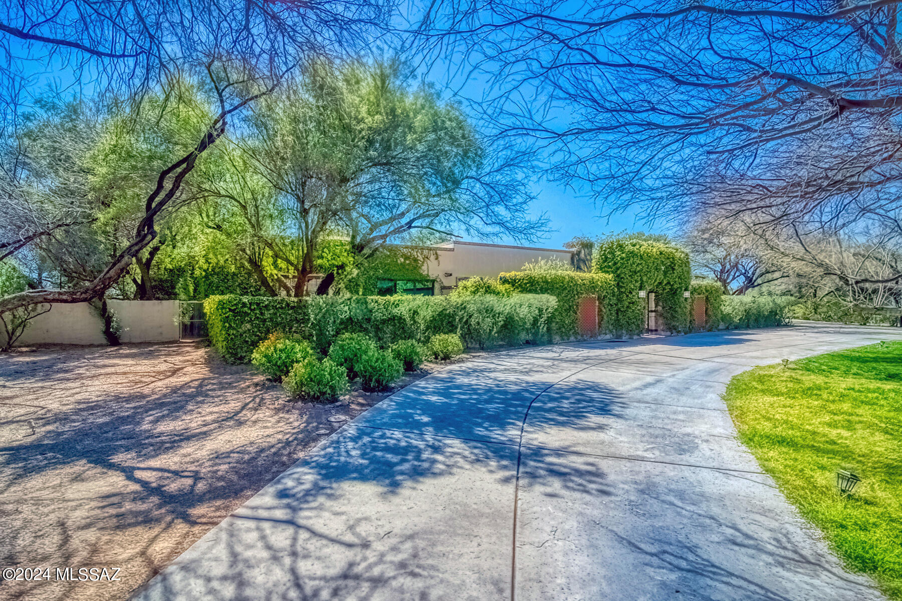 Come & experience this Luxury property in the highly sought after Tucson Country Club. Lush grounds, green grass, fruit trees, citrus trees, & your own pond all sit on a large 1.87 acre lot. Inside boasts a chef's kitchen w/granite countertops, breakfast dining room & formal dining room. Main house is 4 bedroom, 4 bath, w/3 living areas, a large extra room to use however you'd like, 6 car garage, & a 680 sq. ft. workshop. Then walk through your lush backyard with/spa like pool & jacuzzi, covered patio, full outdoor kitchen & into the guest house. Guest house features another 2 bedrooms & 2 baths, along w/home theatre, bar, & wine cellar. Owned Solar and a private well provides for utilities savings all year. Take advantage of all the amenities T.C.C has to offer including gated entry &: 18-hole Golf Course and Golf Shop, 10 tennis courts including 1 Clay court, 4 pickleball courts, and Racquet Shop, Expansive Banquet Rooms for club functions and private parties, Lap pool, Recreational Pool with 90' water slide and children's splash pad, Fully appointed fitness center, Men's and Women's locker rooms, Main Dining Room, Casual Dining Rotunda and Patios, Pool Snack Bar in season, Full-Service Bar & Lounge, Barbershop.