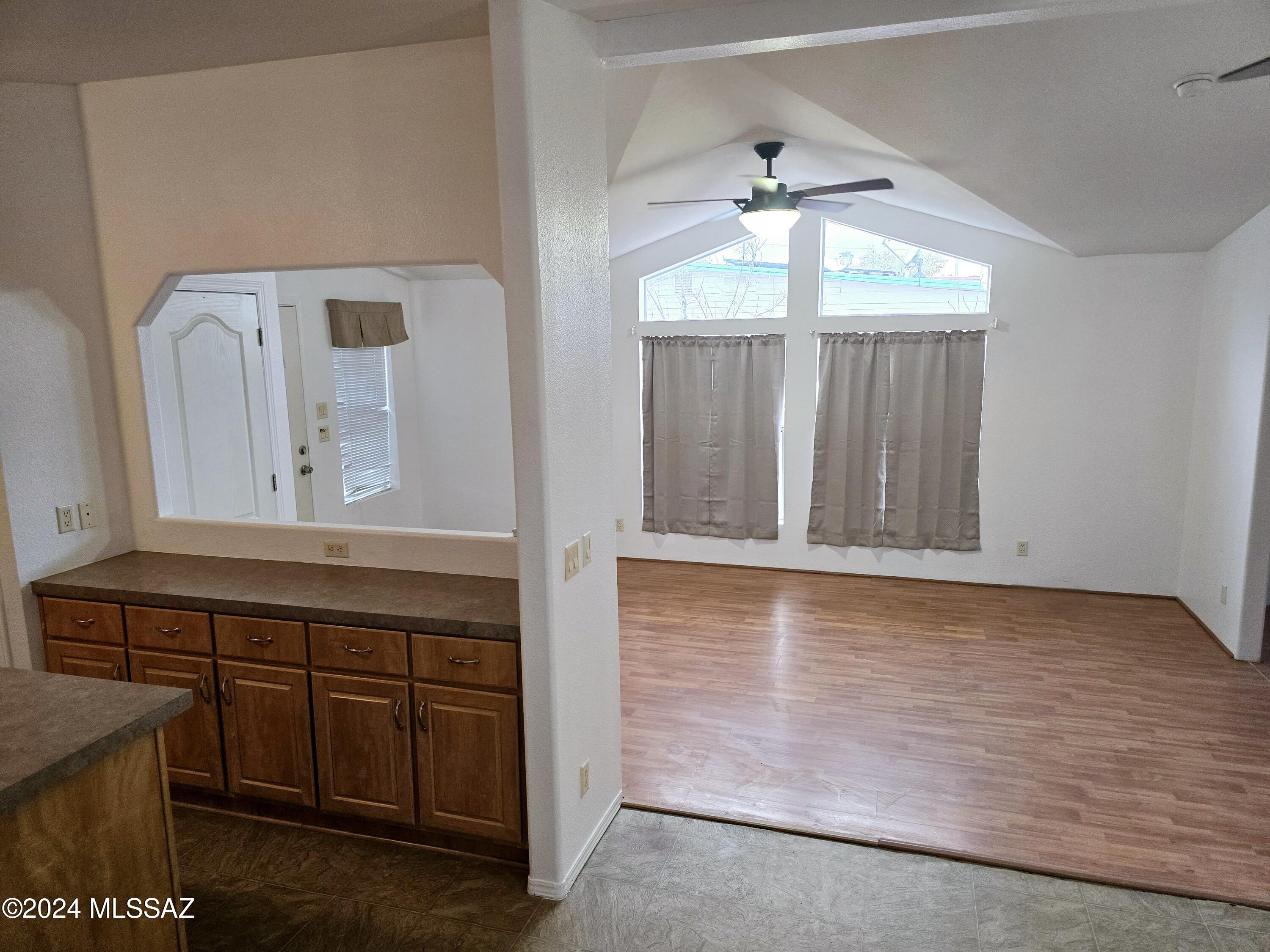 Embrace the opportunity to personalize this well maintained residence. This inviting 2-bedroom, plus den, property features laminate wood & vinyl flooring throughout & a cozy living room perfect for relaxation. The kitchen shines with wood cabinets & ample counter space. The primary bedroom is complete with a private bathroom with walk-in shower. A sliding glass door leads directly to a spacious backyard, where a detached shed offers additional storage options. The versatile den presents a multitude of possibilities, serving as an ideal office, playroom, or potentially a third bedroom, catering to your unique needs. Conveniently located just minutes from schools, freeways, shopping, restaurants & more. Schedule a viewing today & discover the perfect canvas to craft your dream living space
