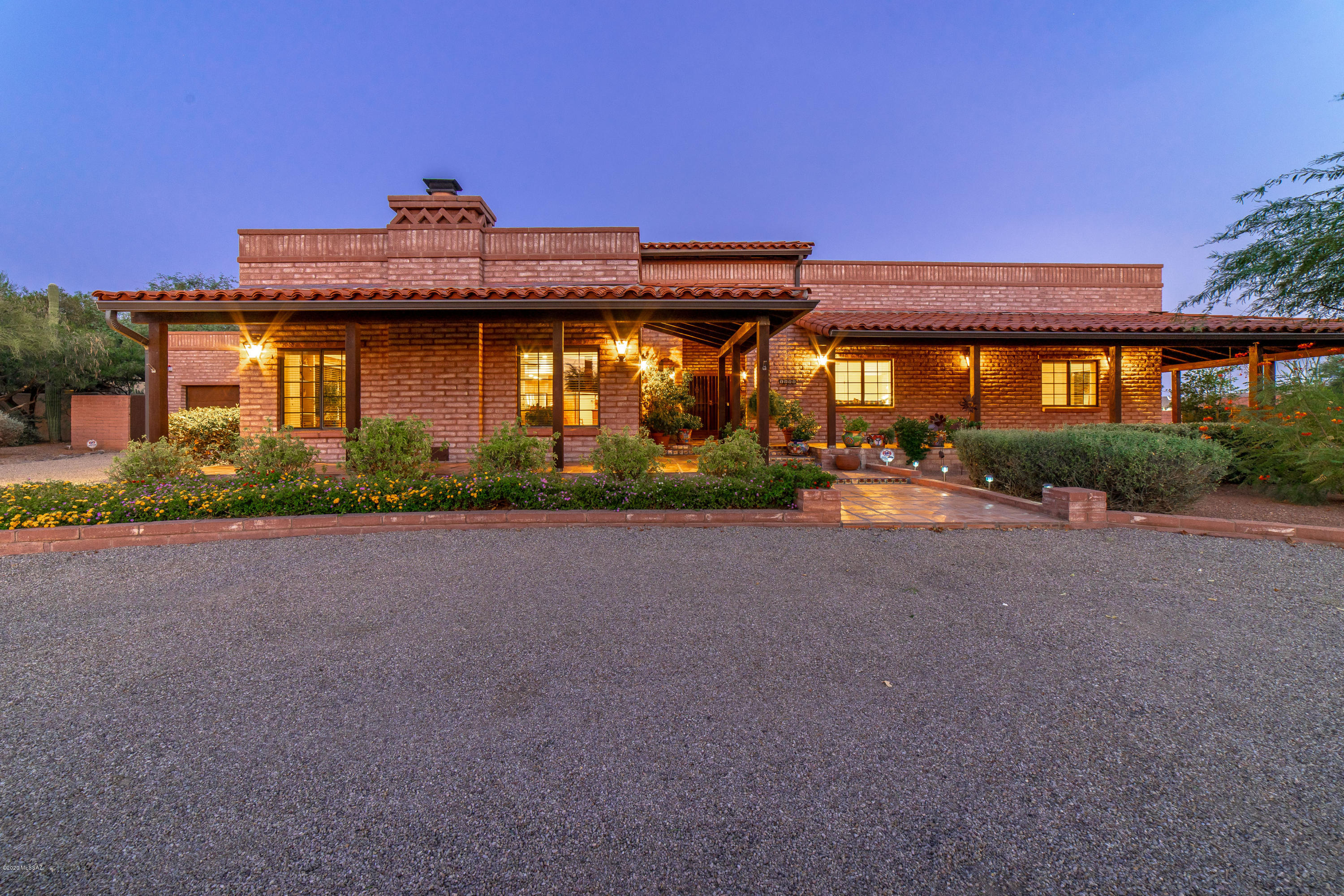 You'll fall in love with this beautiful Territorial Foothills Home in sought after Shadow Hills. Relax on any of the 3 covered porches on various sides of the home, or in your sparkling pool in your private backyard. Immaculate and updated interior with old world charm showing through with the gorgeous accents. Gather in the large Family Room featuring an extensive counter bar opening into the magnificent kitchen. Kitchen features soft close Knotty Alder cabinets and updated Stainless appliances. Plus a Butler's Pantry with wine cooler and Four bedrooms and 3 baths finish off the Foothills masterpiece. Catalina Foothills schools. You won't want to miss this! Owner is a licensed Realtor in the state of Arizona.