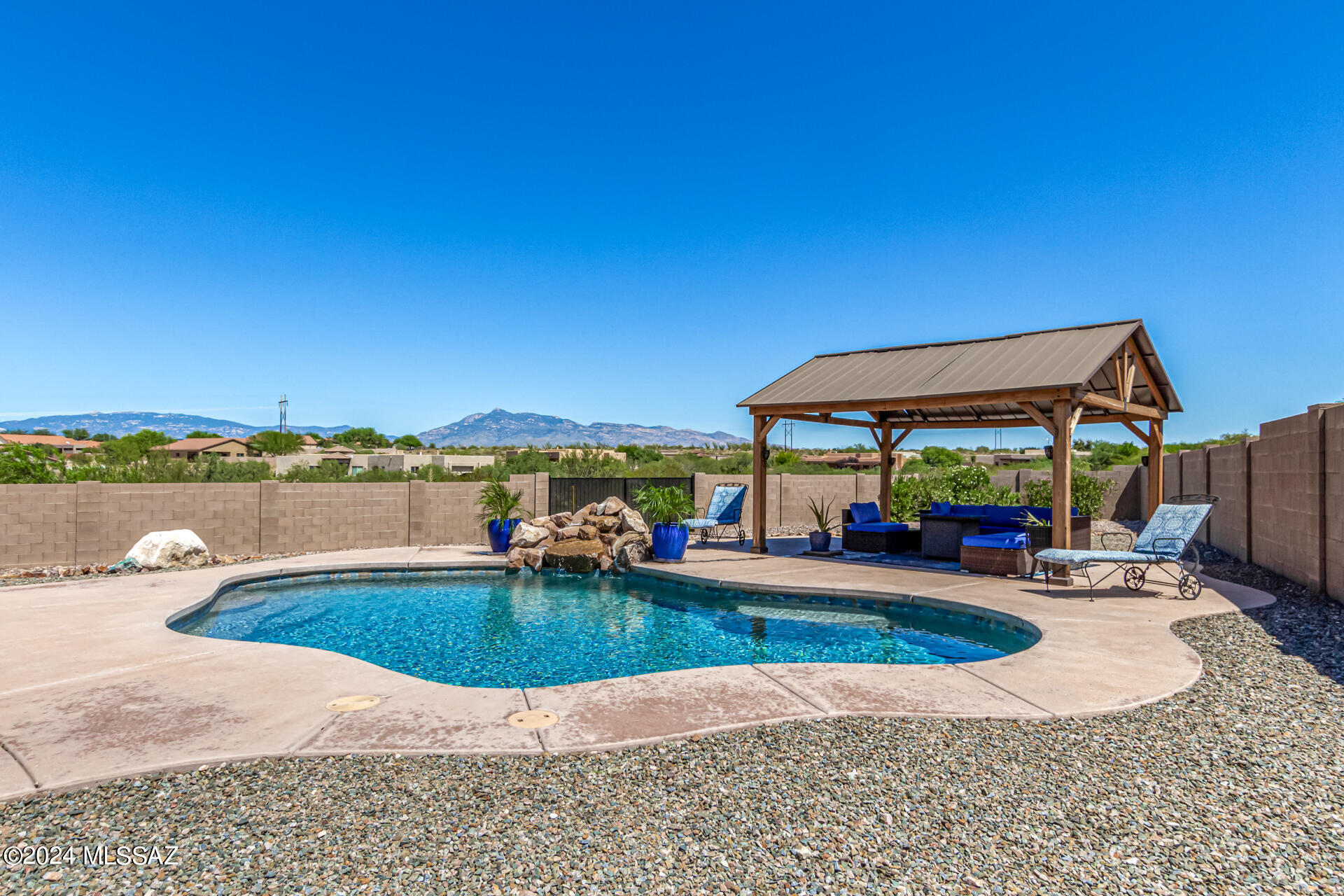 Welcome to your Dream Home! This beautiful 3 bedroom 2 1/2 bath retreat is nestled on a spacious 2.14 acre cul-de-sac lot, offering both privacy and serenity. Open concept with vaulted ceilings, custom window blinds, tasteful stone accents, and stunning wood-look Tile flooring. The gourmet kitchen boasts granite counters with a matching backsplash, abundant wood cabinetry, pendant/recessed lighting, stainless steel appliances, and a two-tier island with a breakfast bar. The primary bedroom includes plush new carpeting, direct backyard access, a large walk-in closet, and an ensuite with dual sinks and a relaxing soaking tub. The enchanting backyard oasis features a covered patio, a charming gazebo, a pebbletec sparkling pool with waterfall, dog run, RV Parking and amazing mountain views.