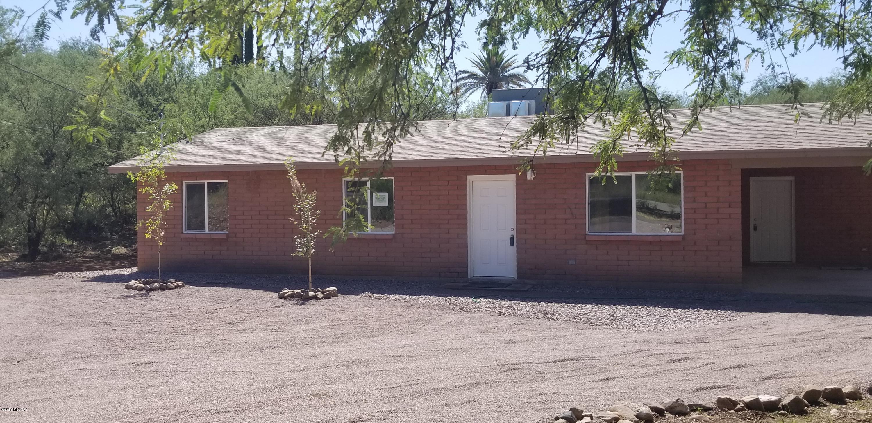 Centrally located in Rio Rico, this comfortable home feels brand new. Every door and window is brand new! Completely new kitchen and bathrooms.   New electrical throughout the home, new roof, new air conditioning, new hot water heater and new plumbing fixtures all make this beautiful home ready for you to move in and start living! This home offers plenty of room and storage.