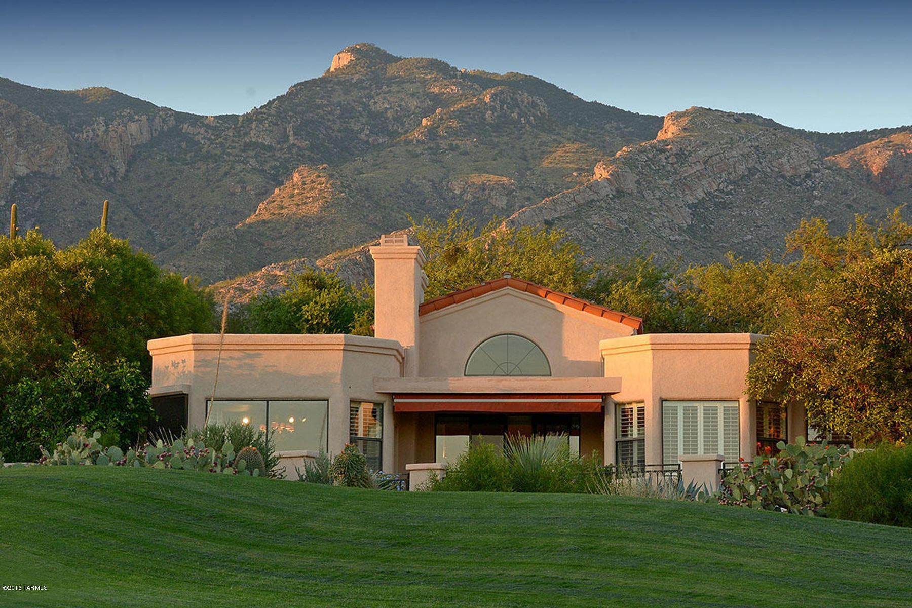 Beautiful home with outstanding views of the city, mountains & La Paloma golf course. Located on the 2nd hole of the Jack Nicklaus signature golf course,   this lovely home features 3 bedrooms & 3 full bathrooms, (could be 2 separate master suites), gorgeous updates & a terrific floor plan. Some of the many features include an open kitchen, vaulted & beamed ceilings, cozy fireplaces in both the living room & family room, split bedroom plan, no interior steps & tile throughout. Upgrades include complete house air filtration system & humidifier, many brand new window & doors (over $25,000), & custom built-in cabinetry in the master suite. 24-hour guard gated community has neighborhood pool & spa. Close to La Encantada, fine restaurants, golf & art galleries. Truly a spectacular residence.