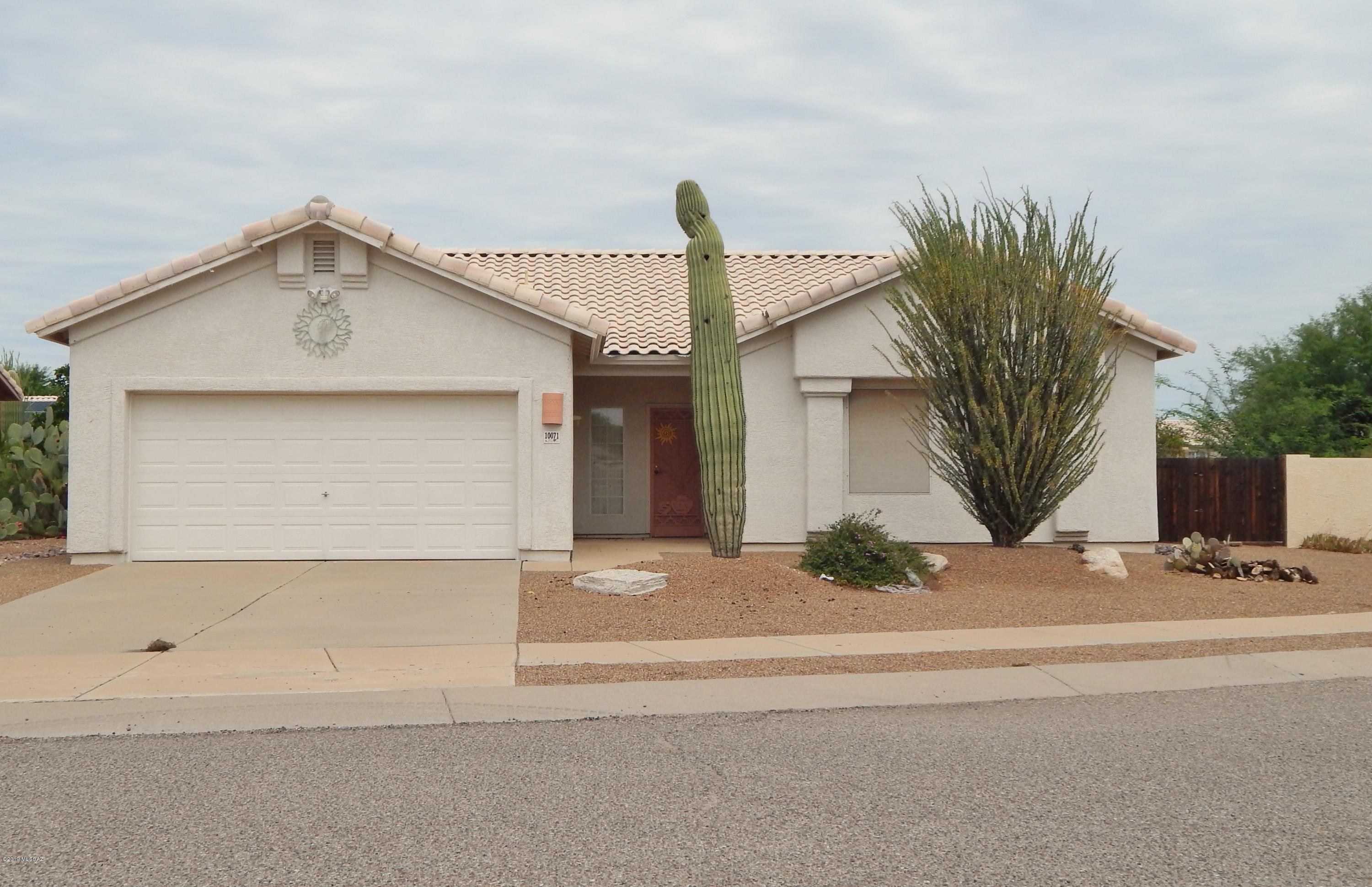 Pride of ownership abounds in this Rita Ranch gem! The home is move in ready and includes all appliances. Title flooring in all the common areas with carpeting in the spacious bedrooms. The master suite has a walk in closet and dual sinks and separate tub and shower in the bath. The kitchen has an eat in dining area and large pantry. The large back yard is fully landscaped and features a full length covered patio. Behind the home is a drainage way (wash) providing extra privacy. Most of the furnishings are available for sale on a separate bill of sale. This one will not last long!