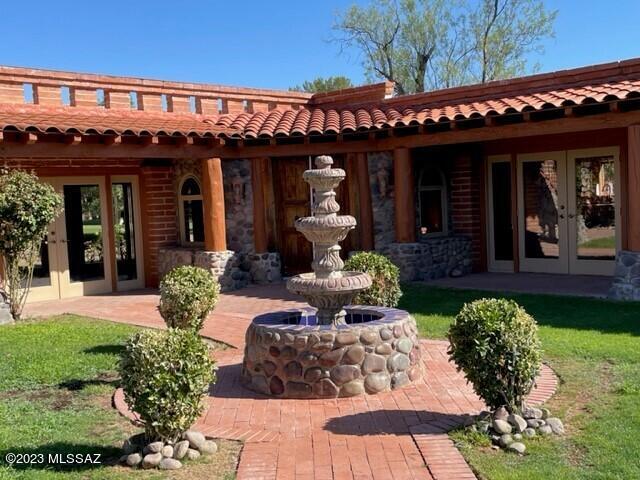 A unique two bedroom/two bath home with many custom features, that include a beautiful courtyard with fountain and veranda style patios, several fireplaces, and stairway to a sky terrace. Inside includes a re-modeled kitchen, stone walls and log pillars.
Home is a golfer paradise located on Hole #1 of the Otero golf course.  Spectacular views of the mountains and golf course. A MUST SEE!