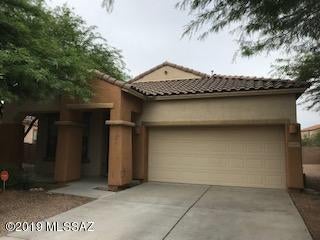 LIKE NEW KHOV 2007 HOME. PREMIUM LOT AND UNOBSTRUCTED VIEWS OF THE TORTOLITA MOUNTAINS. SPACIOUS FLOORPLAN INCLUDES FORMAL DINING AND LIVING ROOMS. OPEN KITCHEN WITH GRANITE COUNTERTOPS, STAINLESS STEEL APPLIANCES, WASHER & DRYER, EXTENDED CENTER ISLAND, TILE/NEW PERGO FLOORING IN LR & GR CARPETS IN BEDROOMS. GREAT ROOM HAS GAS FIREPLACE. BAY WINDOW IN MASTER BEDROOM AND EXTRA LARGE WALK-IN CLOSET. COVERED PATIO AND FINISHED BACKYARD.NO PETS!