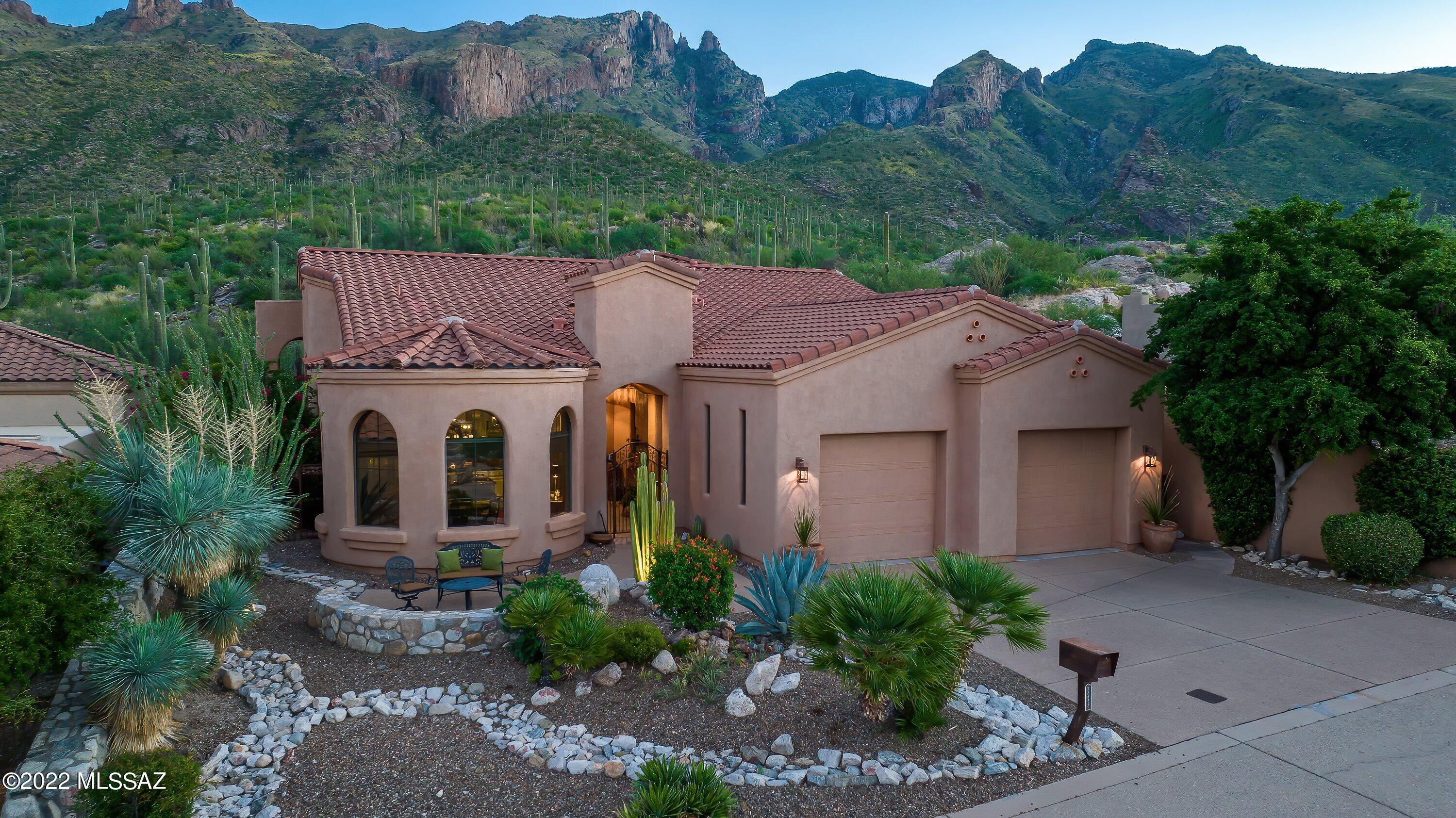 LOCATION LOCATION LOCATION! Look no further, this is your dream home! Fantastic opportunity to own a spectacular one of a kind home in the Foothills. Marvelous 3 beds 2.5 baths 1 den/office, extended double car garage, single story home w/many impeccable upgrades. The house is flawlessly maintained with tons of wonderful features that will check off everything in your dream home list. Grand entrance w/amazing stone pillars and mosaic inlay polished concrete floor throughout. Very open concept, 20 feet high vaulted ceiling, lots of windows bringing tons of natural lighting. Fabulously upgraded kitchen w/granite counter, stainless steel appliances & professionally remodeled high quality cabinets. Spacious living room, family room, gas fireplace, formal dining room, breakfast nook ... w/spectacular city view. Gorgeous 2.5 bathrooms w/lots of stunning factors. Beautiful en-suite master with double vanity, separate jetted tub & shower, big walk-in closet. Amazing backyard features hot tub, built-in BBQ grill & bar, mature grape vine & lovely landscaped plants. Wonderful premium lot with magnificent city view, mountain view, sunset, sunrise, you will have it all. This gorgeous house backs up to Pontatoc & Finger Rock trail on 3,100 feet elevation, you literally can just open the backyard gate and hop on the hiking trail. Talking about that truly & real mountain view right in your backyard. Gated community bordered by Coronado National Forest. Very desirable & popular Foothills location, next to La Encantada shopping, restaurant & entertainment center. Original owner. Built 2003 by Pathway Developments. List of home improvements & upgrades will be attached to the listing.