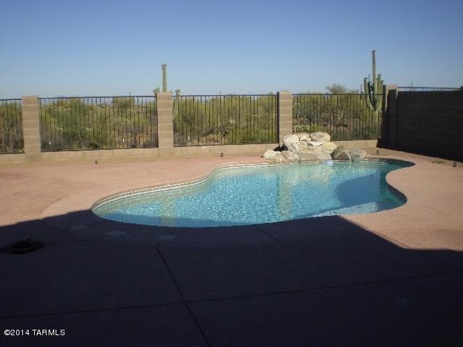 Beautiful 3 bedroom w/ den In Dove Mountain. Cherry Cabinets in Kitchen, Stainless Steel Appliances, Granite Counters, Frontload Washer & Dryer, Tile in Main Living Area. Enjoy the summer w/Private Pool with Water Fall. Pool Maintenance is included. Great Mountain Views!!! Must See....