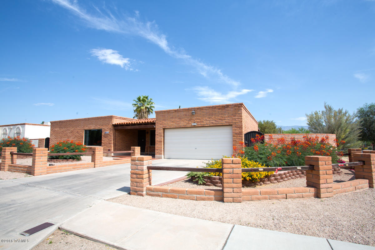 Well maintained updated 4 BR 2 BA home. Beautiful kitchen with granite countertops and GE Profile appliances. Large privacy windows in dining and living room. Dual cooling, heat pump installed in 2007. French doors lead out to newly landscaped backyard with huge patio, built-in firepit and fountain. Low maintenance landscaping with fruit bearing trees including a peach tree! Irrigation system, ceramic tile throughout and new carpet in bedrooms. Freshly painted Ralph Lauren design colors.