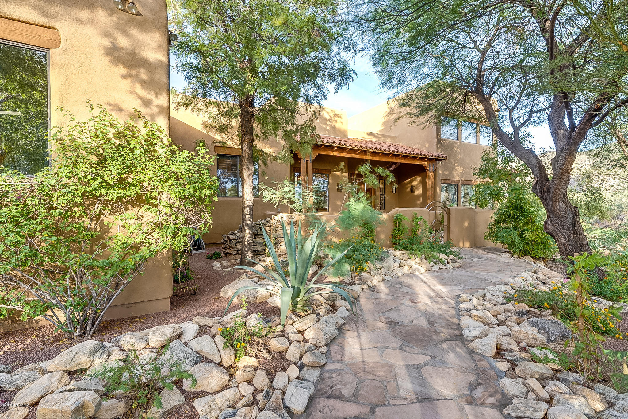 Extraordinary property!  Private gated comm., 3.48 AC w/180-degree views of Catalina & Rincon mtns! Welcoming stone courtyd entrance w/enchanting water feature, 4 BRs, 2 offices, 3.5 baths- all on 1st level! Upper level features 20x20 family rm w/walls of windows &  wraparound balcony-Breathtaking Views!!  Discover hidden 'safe rm (collections, or private office!). Enter property through 2nd private gate- discover a paradise of landscaping & tranquility! Great rm w/high grade laminate floors, new SS appliances, 3 FPs, kitchen & nook area! Split floor-plan, spacious master ste w/FP, guest en-suite & 3 additional BRs! Private well- NO Water Bills! TV Schools. Endless protected views!  Space for pool & horse facilities. Adjoining 3.3-acre lot available 21927335 !  Pre-sale home inspection.