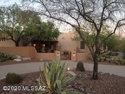What a beauty! Southwestern contemporary home on over 3 acres and in a gated community. 5 spacious bedrooms, and 6 bathrooms inside this huge home! Spacious floor plan, large kitchen with an island and tons of cabinet space with granite counter tops. Enjoy the uninterrupted views of natural Tucson beauty  from the large backyard, which is perfect for activities and gatherings. This home wont last long! Schedule a showing today.