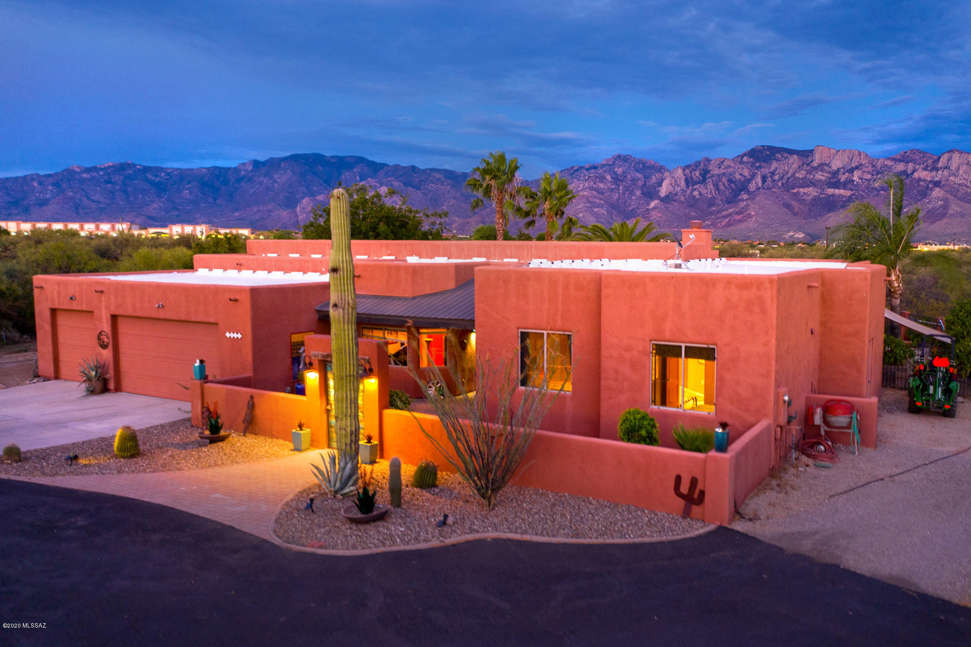 A true desert oasis is waiting for you behind these courtyard walls! This custom gated 3.31 acre Oro Valley property with unobstructed Catalina Mountain views and sparkling city lights is truly a rare find! Travertine flooring, granite countertops, stainless steel appliances, tall ceilings and an open and inviting floor-plan are just a few of the features you will find in this home. Enjoy a book in front of your beehive fireplace or relax on your covered patio and take in the views that made Oro Valley famous!  Your new backyard features a pool, spa, and outdoor kitchen along with mature fruit trees and grape vines. The property has horse facilities available and plenty of room to park your trailers, RVs and other toys. Enjoy the privacy and serenity of this home while still being minutes from shopping, dining, golf and entertainment. Schedule your private showing today!