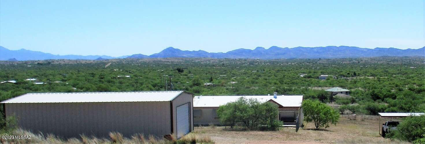 You'll say 'Oh Wow' when you enter this Well-Maintained Manufactured Home on 4.82 acres with awesome Mountain Views and no HOA. 40 ft Shop, plus a Storage Shed and 2-Car Carport with a place for all your toys and even horses. Property is fenced with a Solar Gate. Front Yard is fenced to keep your pets in and critters out. 2 parking pads for Self-Contained RVs. Front and Back decks for Indoor/Outdoor Living and/or Bird Watching. Private Setting on a paved road. Enjoy country living close to the Buenos Aires National Wildlife Refuge.