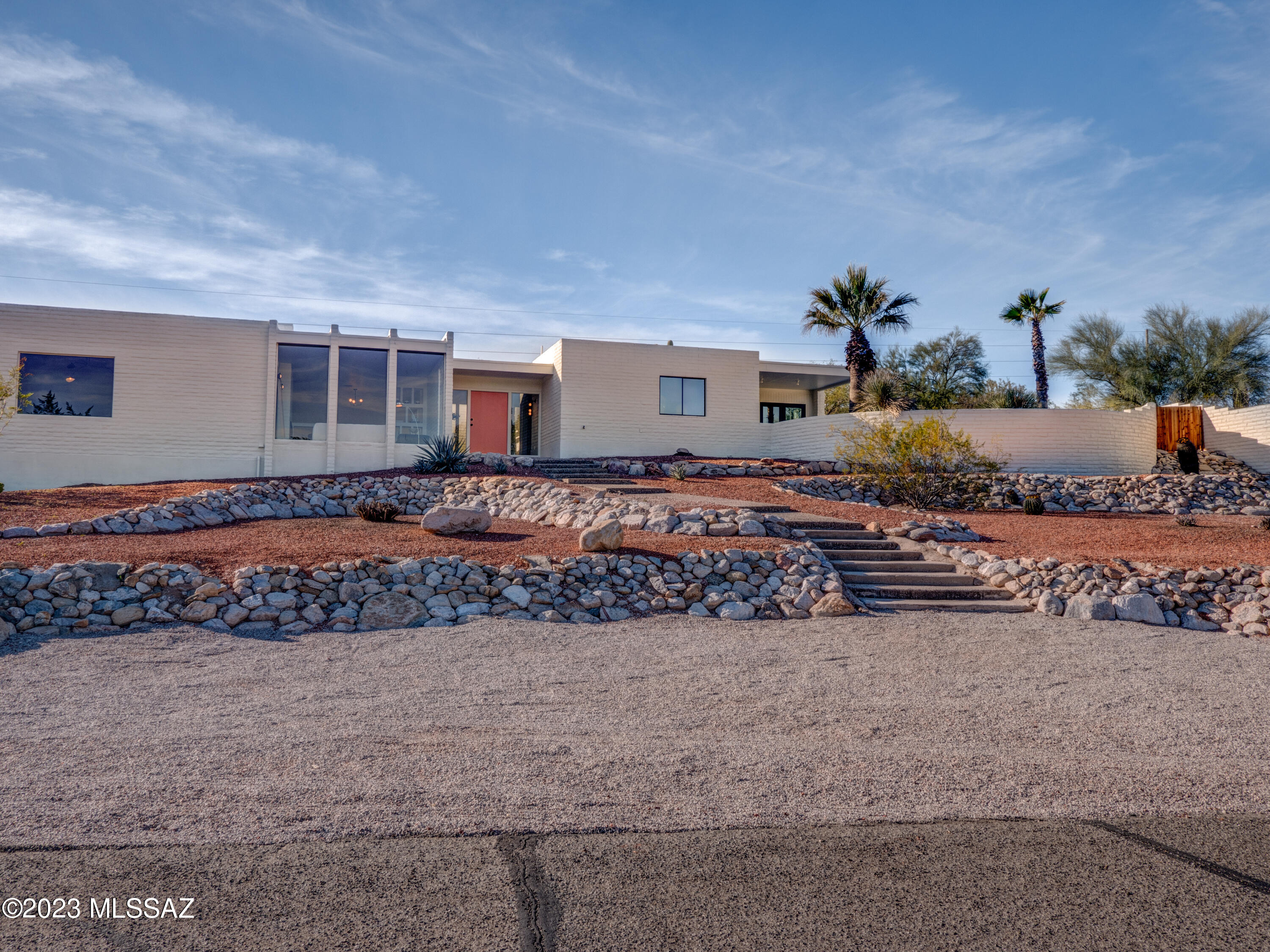 Desert Modernist in the Catalina Foothills. This Palm Springs inspired Devall Design features 3BR, 2BA with awesome views from inside & out. Kitchen includes stainless appliances, Quartz waterfall edge counter tops & Italian handcrafted leathered backsplash tile. Curated lighting throughout. Large format porcelain & engineered hardwood flooring. The two amazing bathrooms feature Delta fixtures & beautiful tile enclosures. The backyard is anchored by a re-plastered & tiled pool with new equipment making the space perfect for family or entertaining.